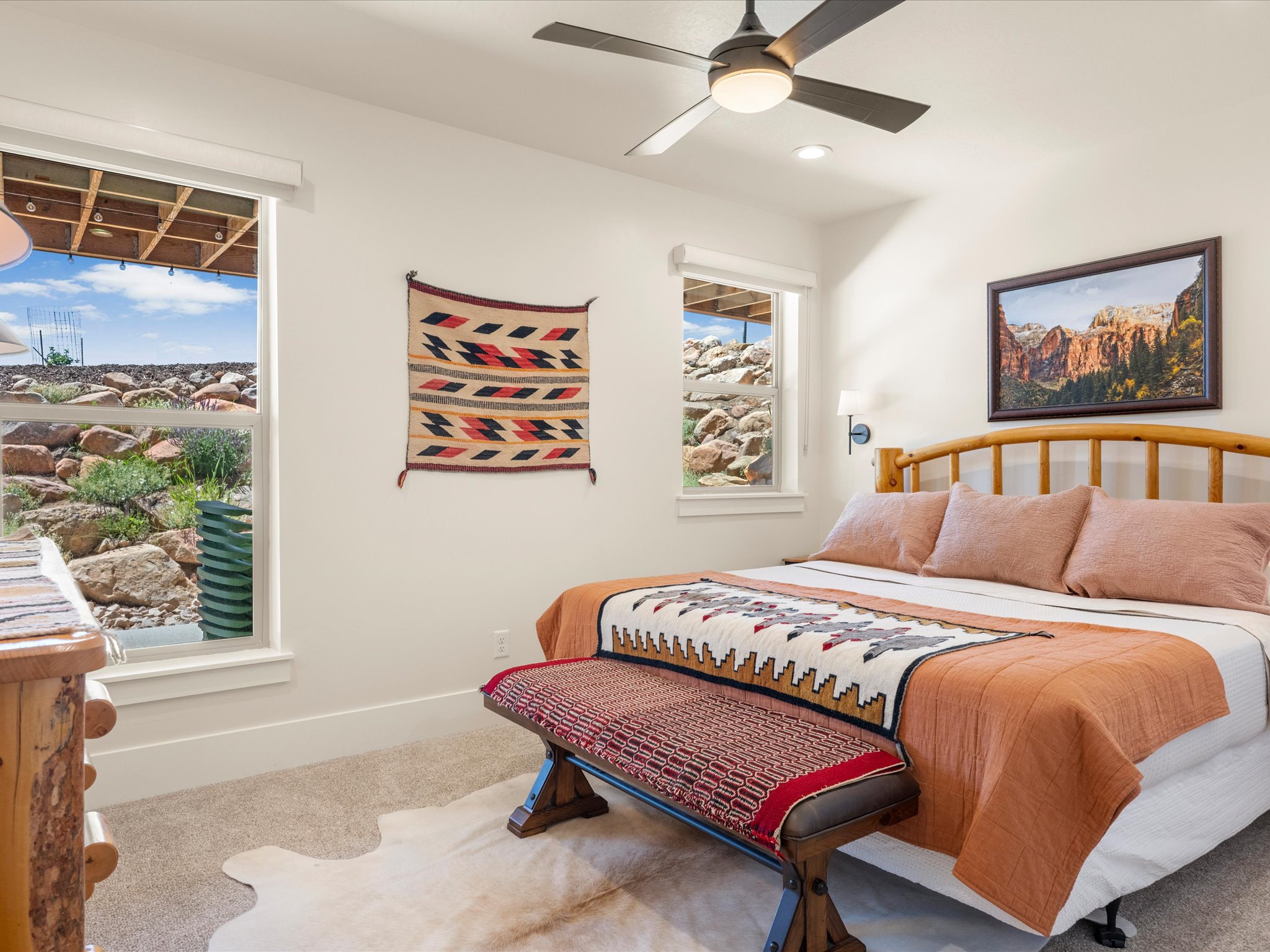 Bright room featuring a ceiling fan with integrated lighting, recessed lighting, and carpet flooring