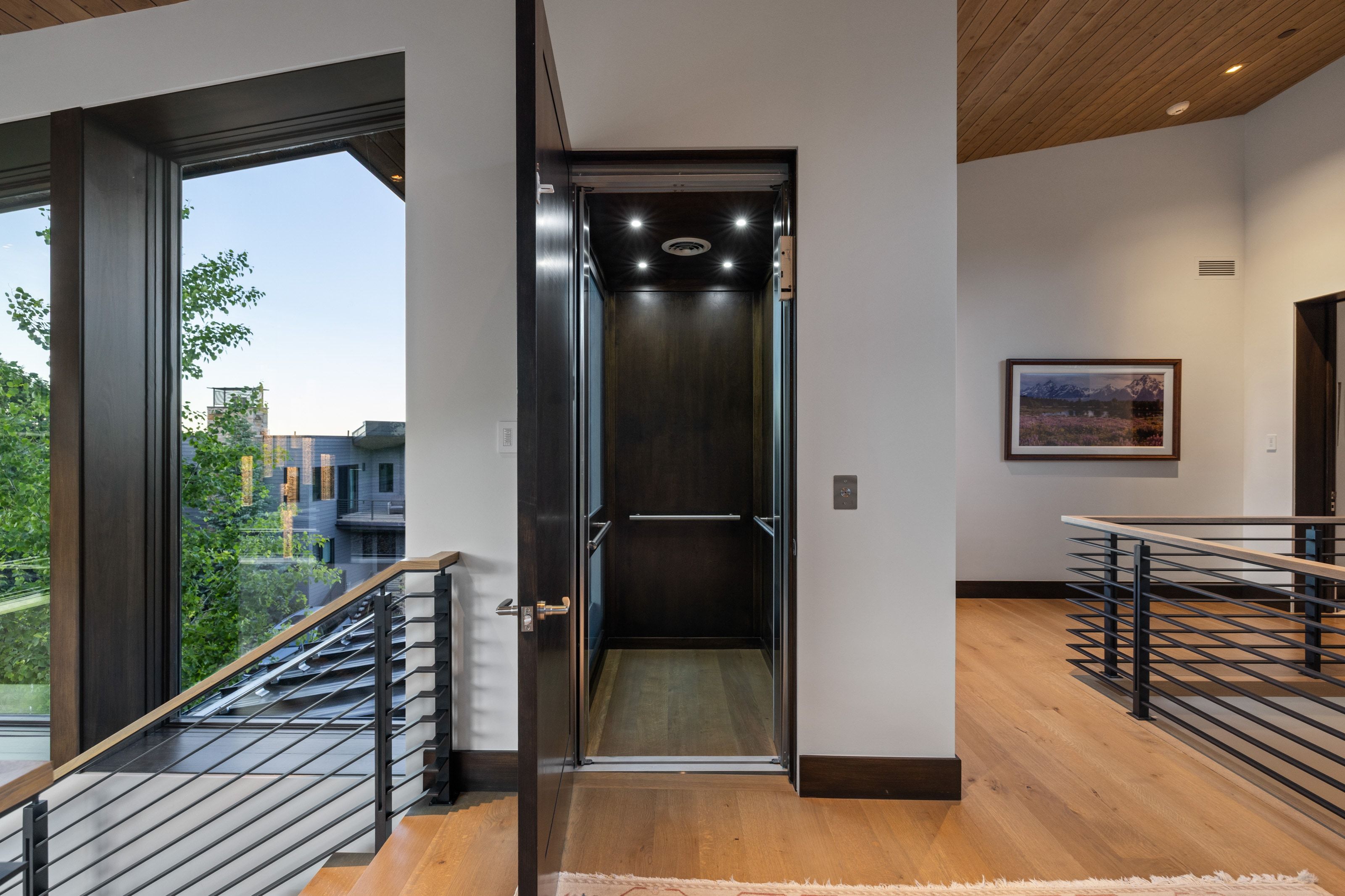 Elevator with wood-finish interior and recessed lighting