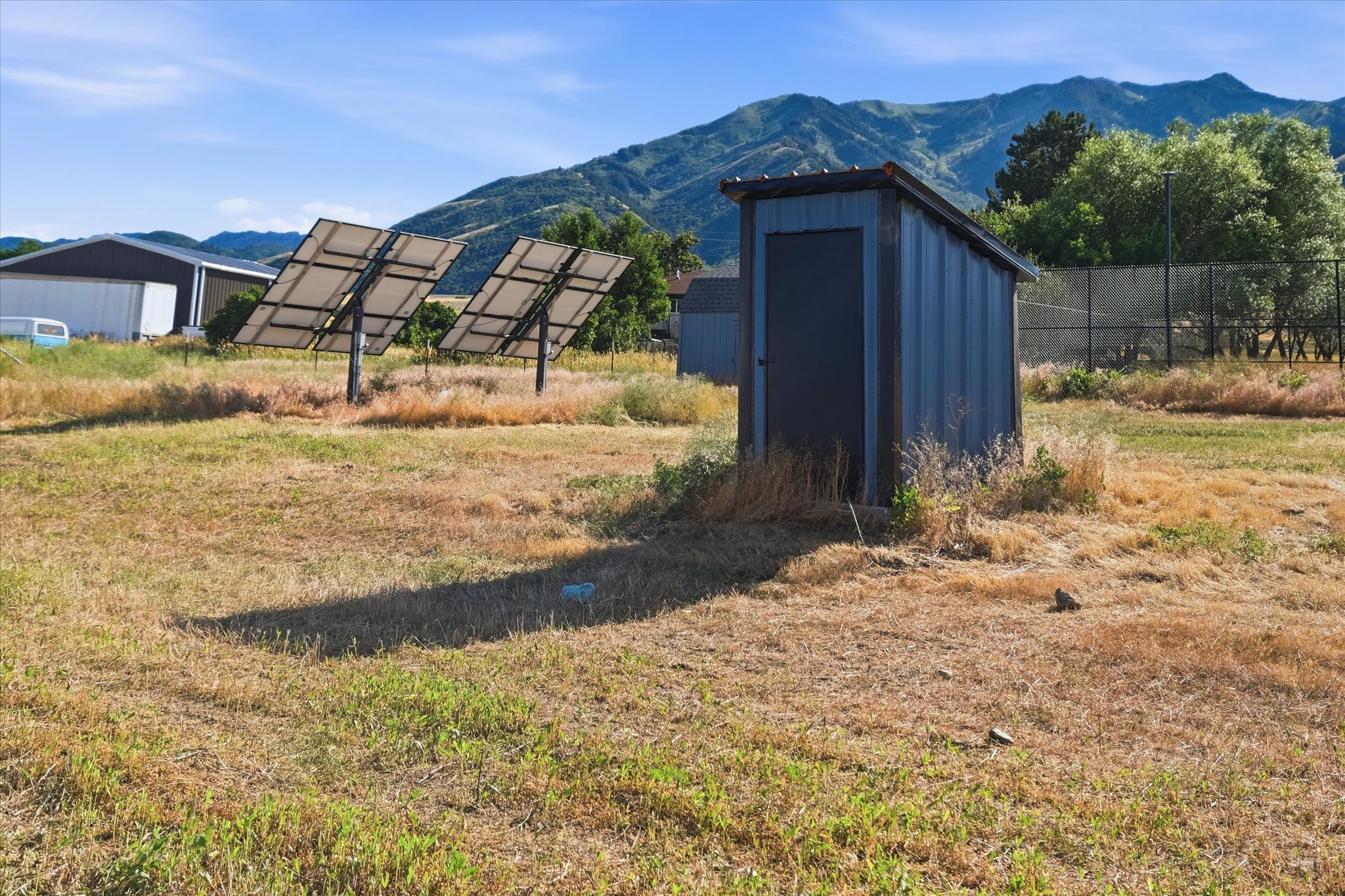 Exterior outbuilding with corrugated metal siding