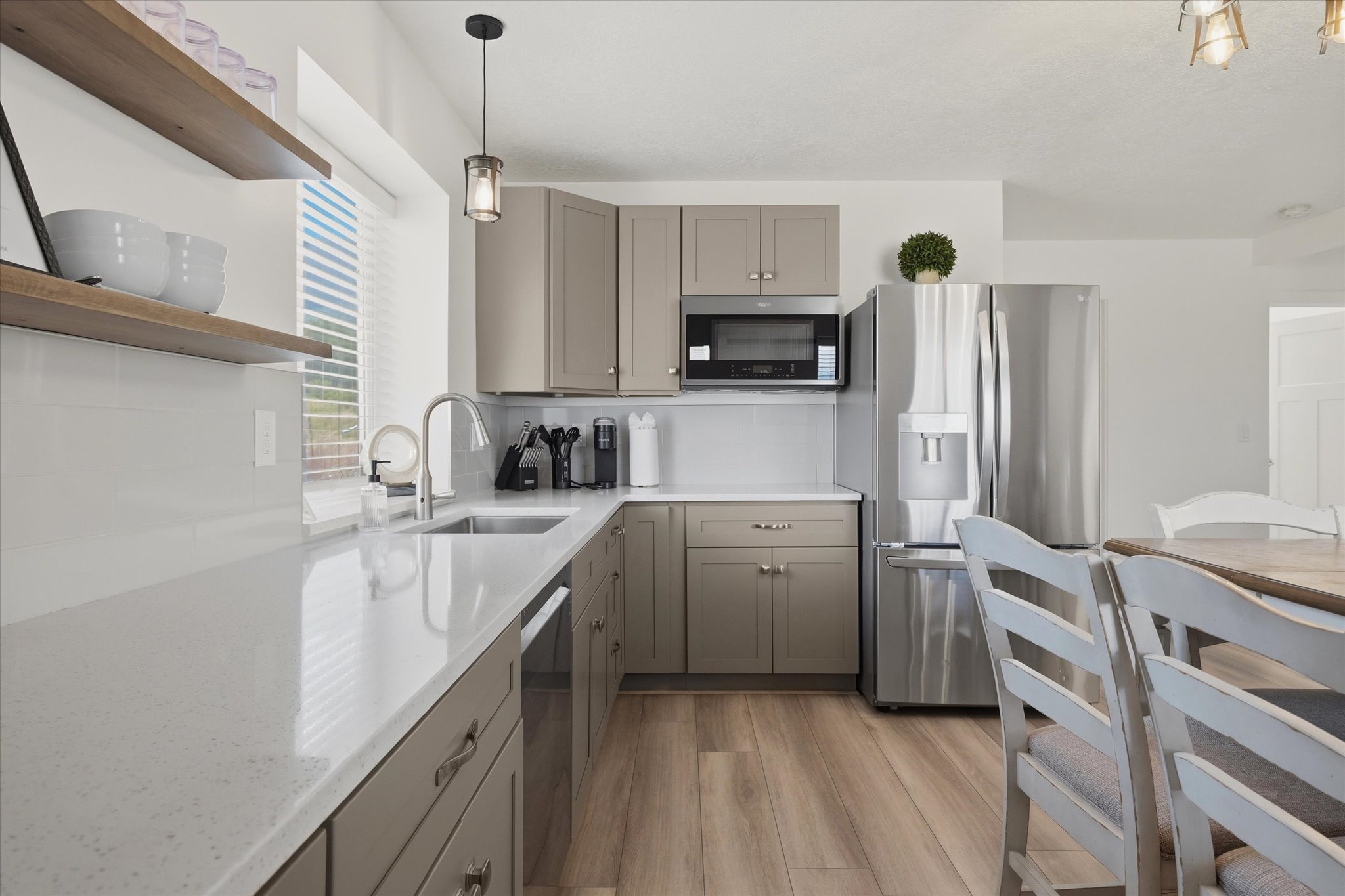 Modern kitchen with light wood-finish flooring