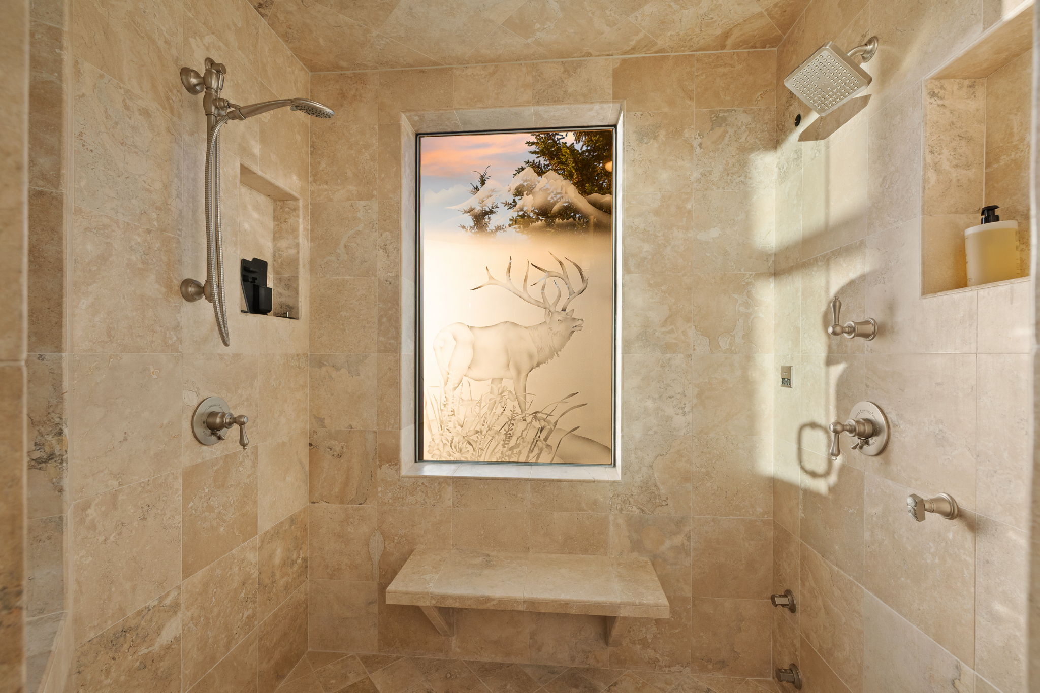 Tiled shower featuring a decorative window, a built-in shower bench, and a niche for storage