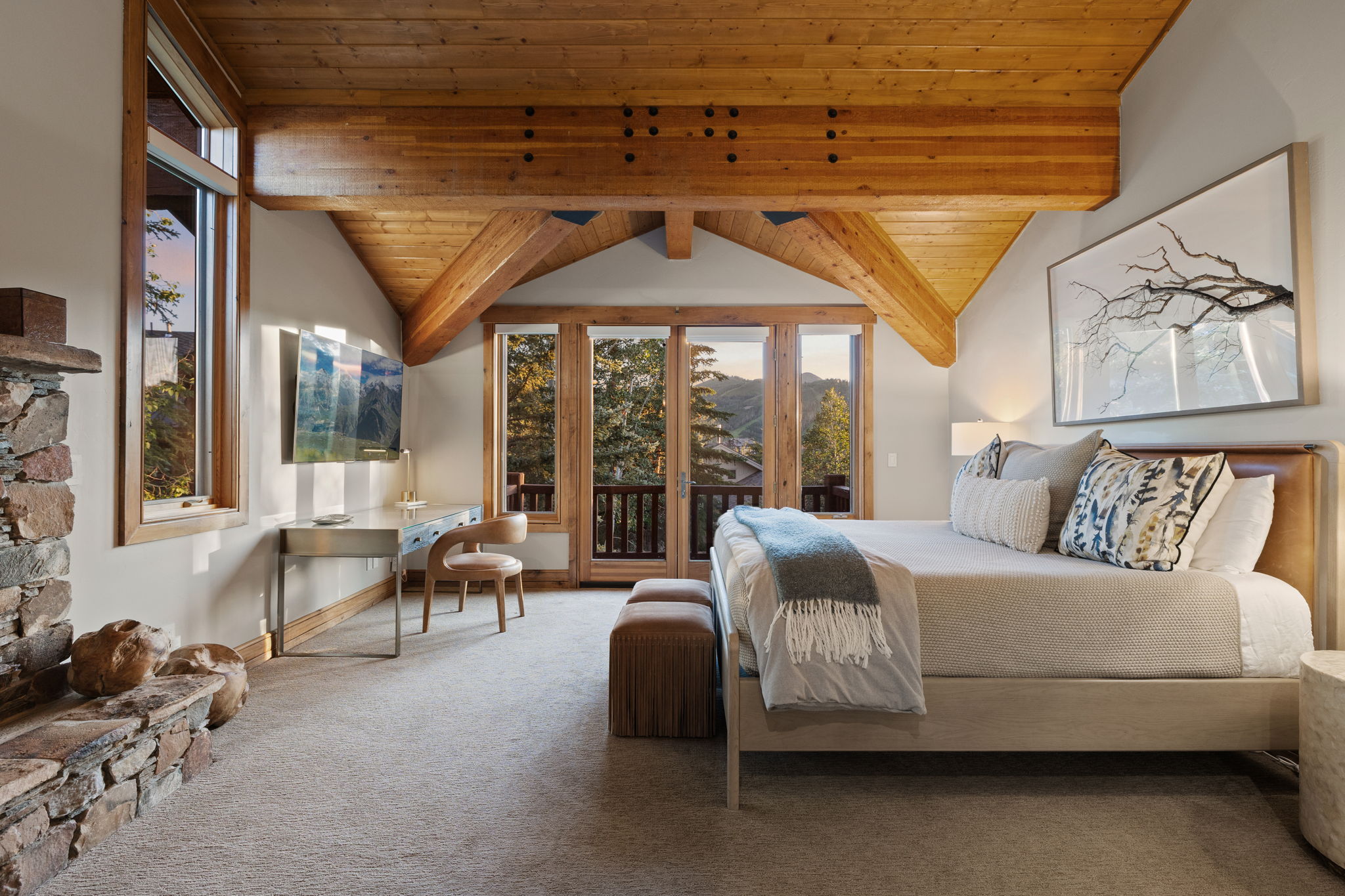 Vaulted ceiling featuring exposed wood beams and wood-finish ceiling