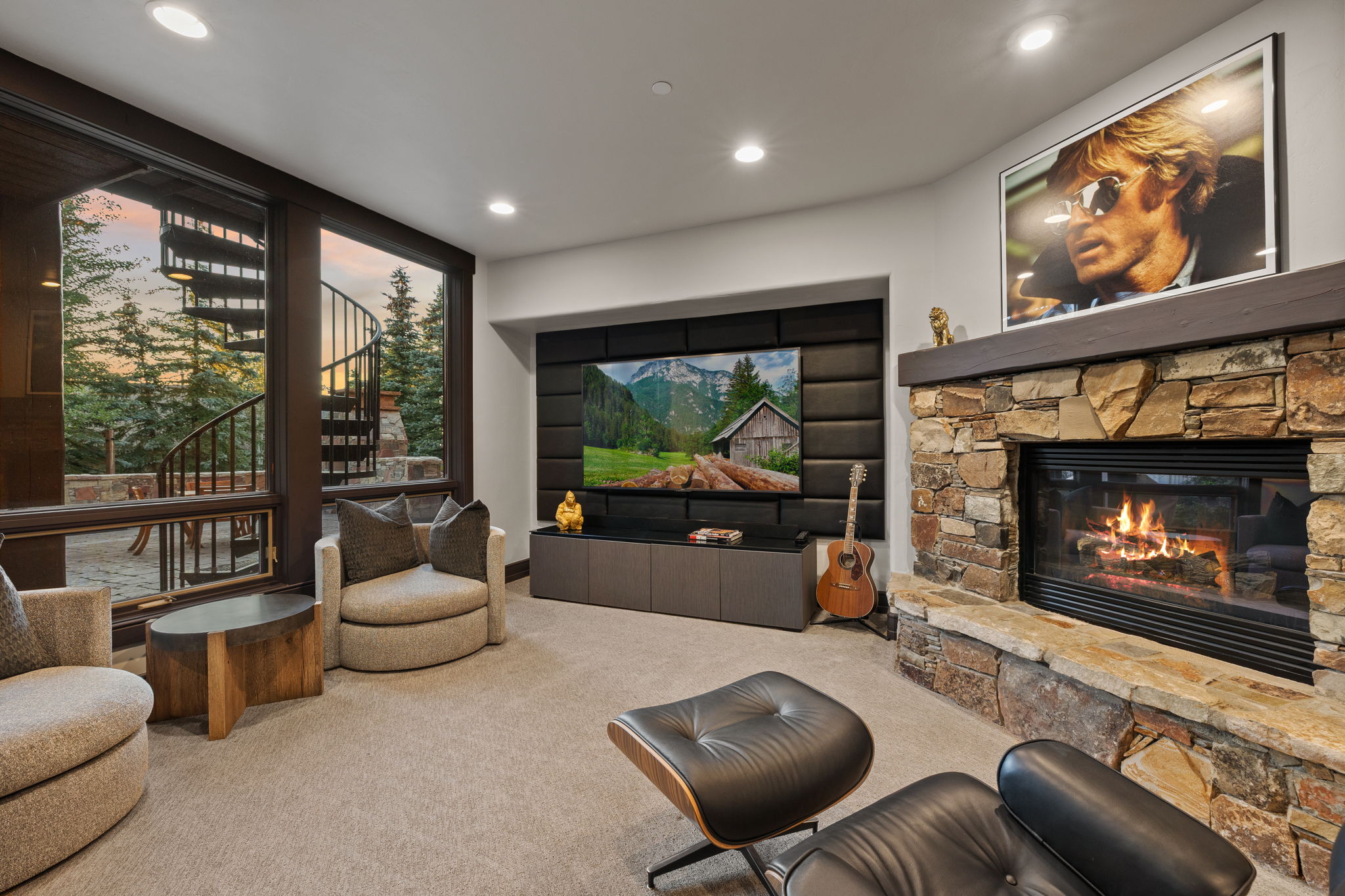 Stone-clad fireplace with a wood mantel