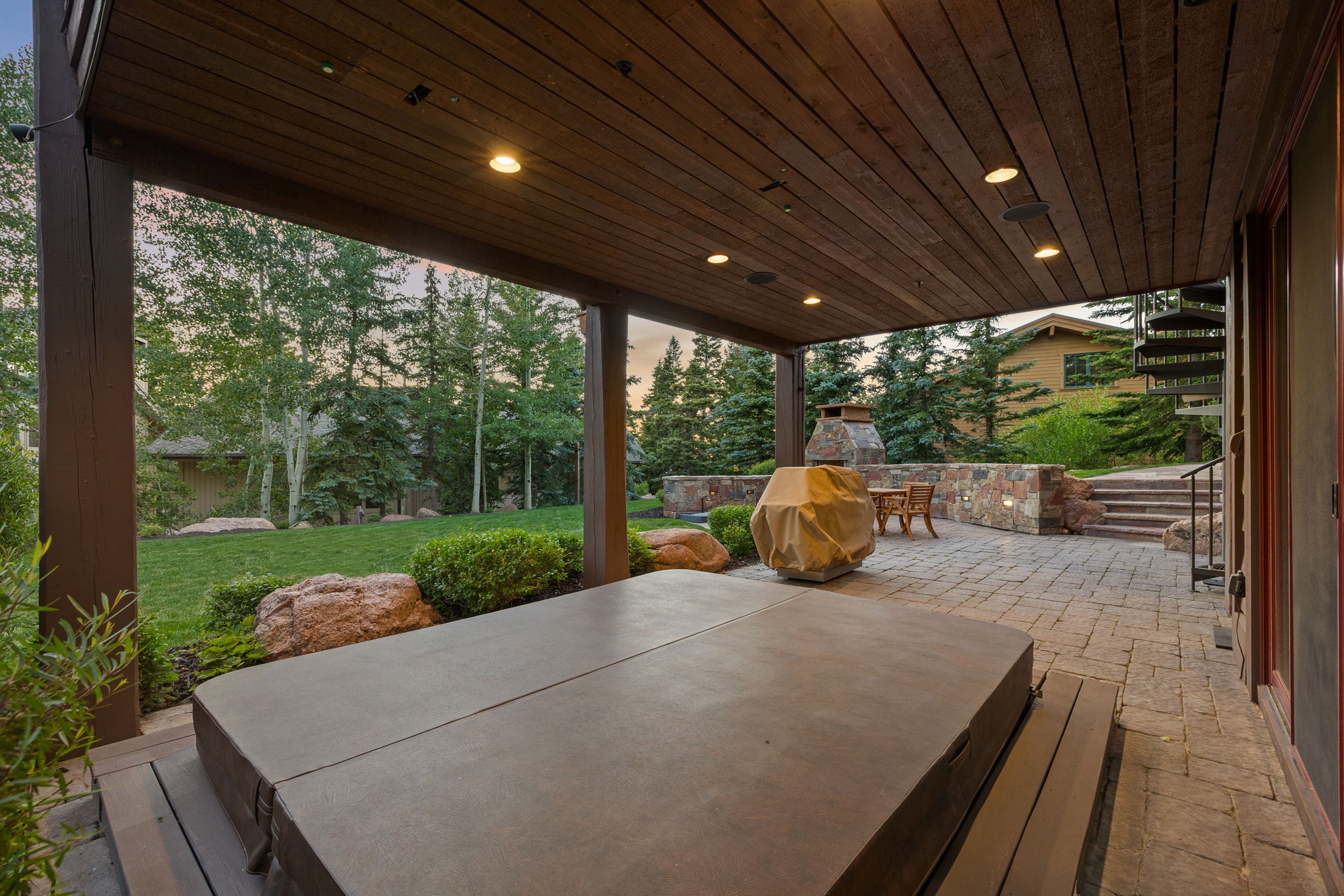 Covered patio featuring a wood-finish plank ceiling with recessed lighting