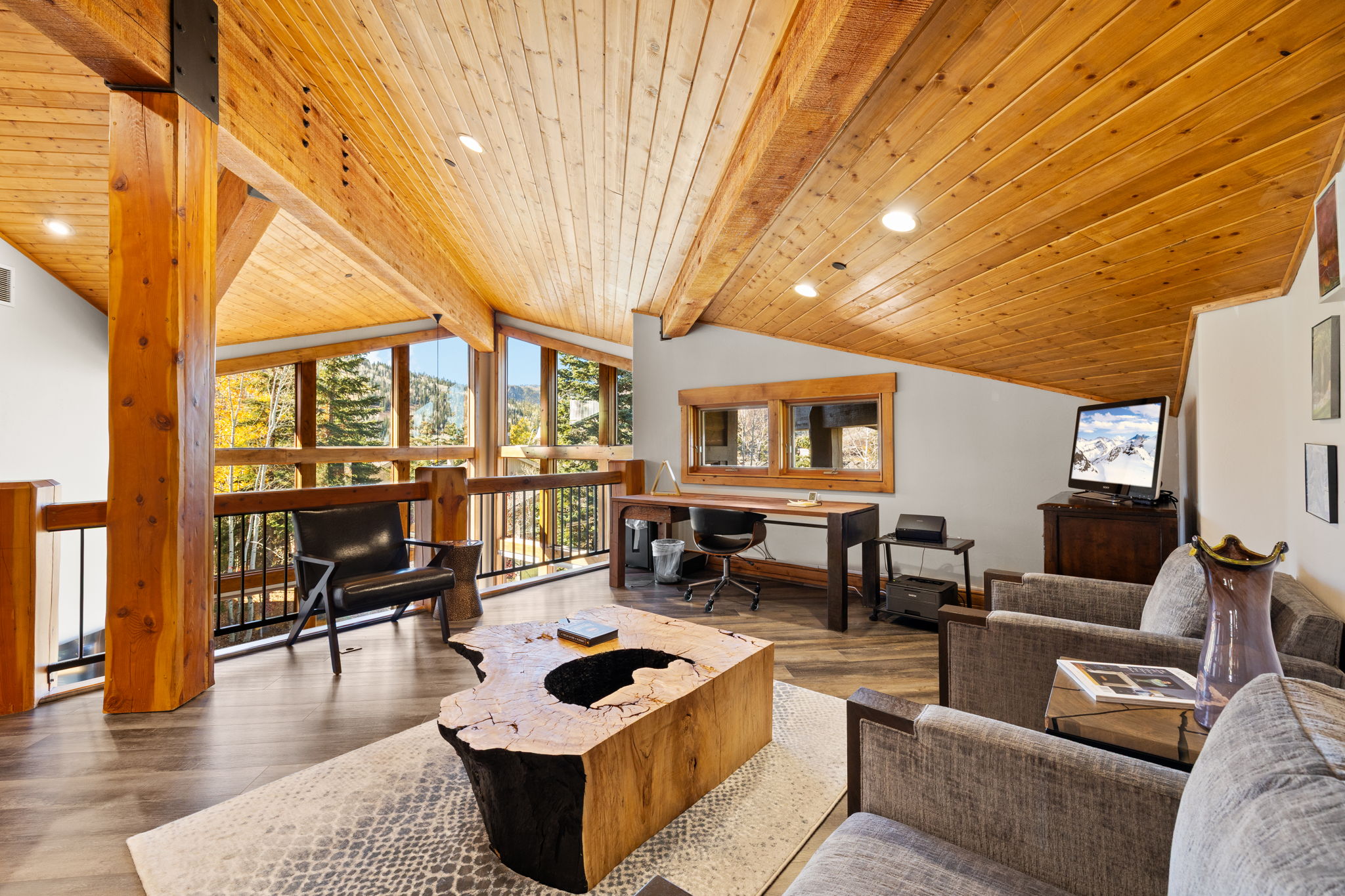 Vaulted wood-paneled ceiling with recessed lighting