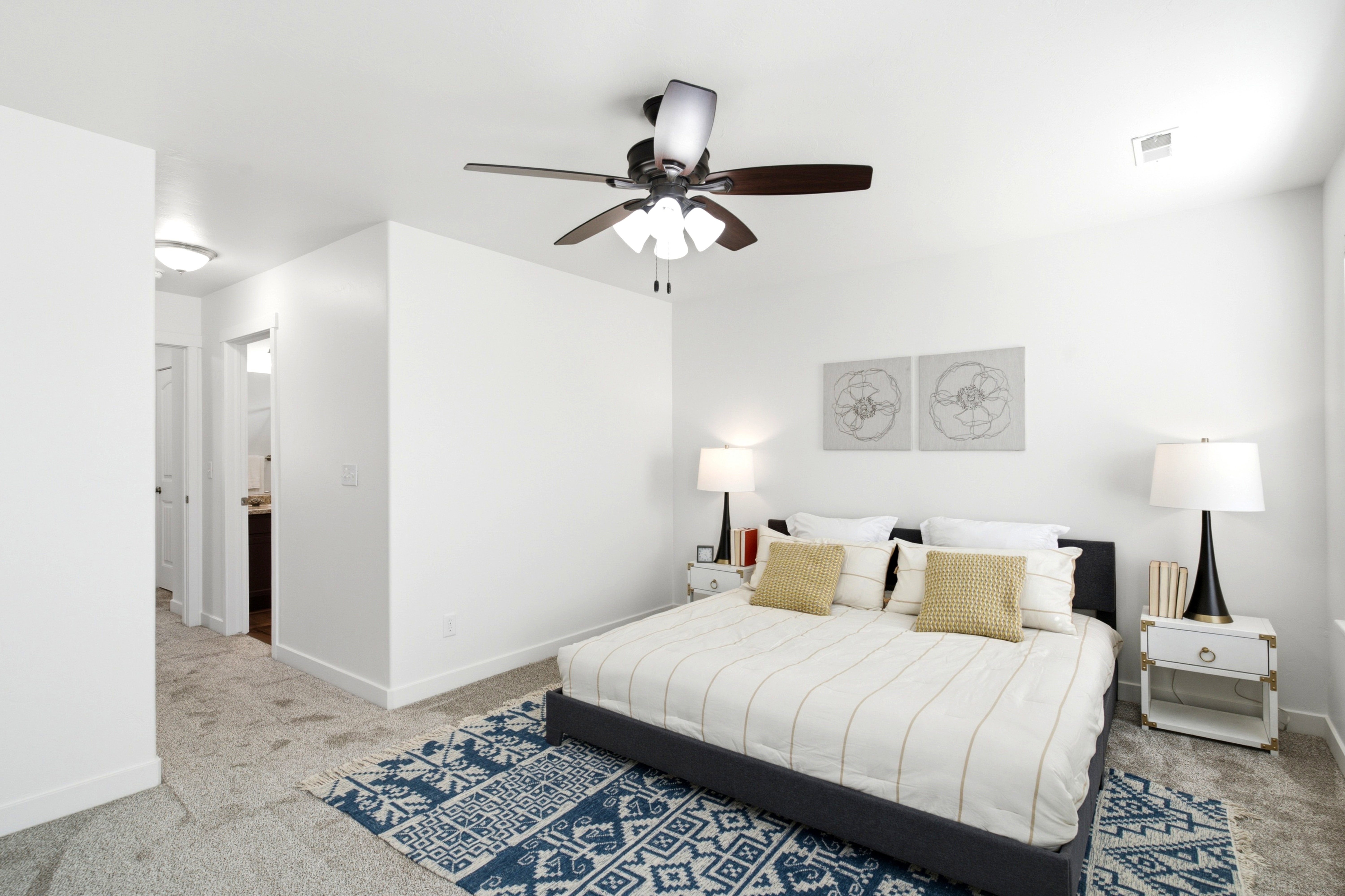 Bedroom featuring a ceiling fan with integrated lighting, recessed lighting, and neutral carpeting