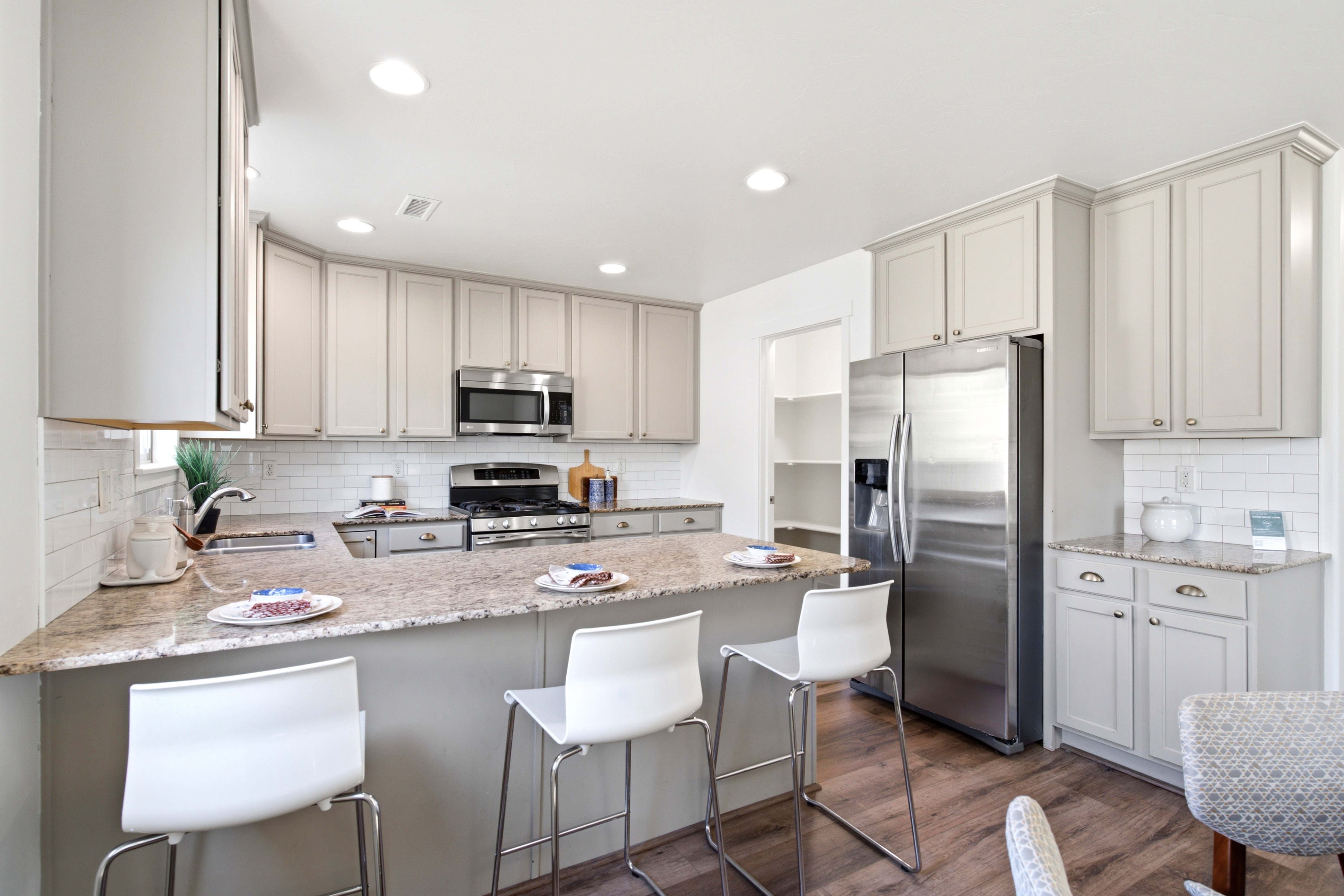 Kitchen featuring light wood-finish flooring and recessed lighting
