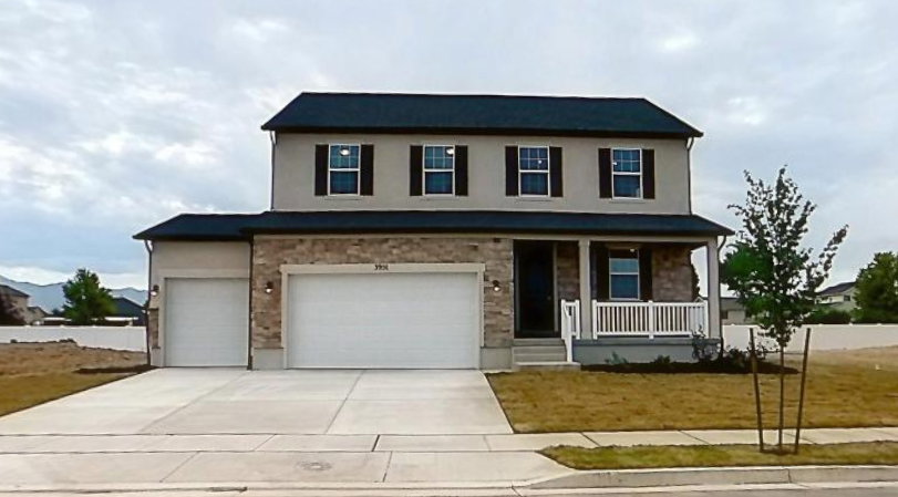 Two-story Hemingway plan with a stone facade and stucco exterior and a 3 car garage. Picture of this finished home. Front yard Landscaping and rear fence are already installed.