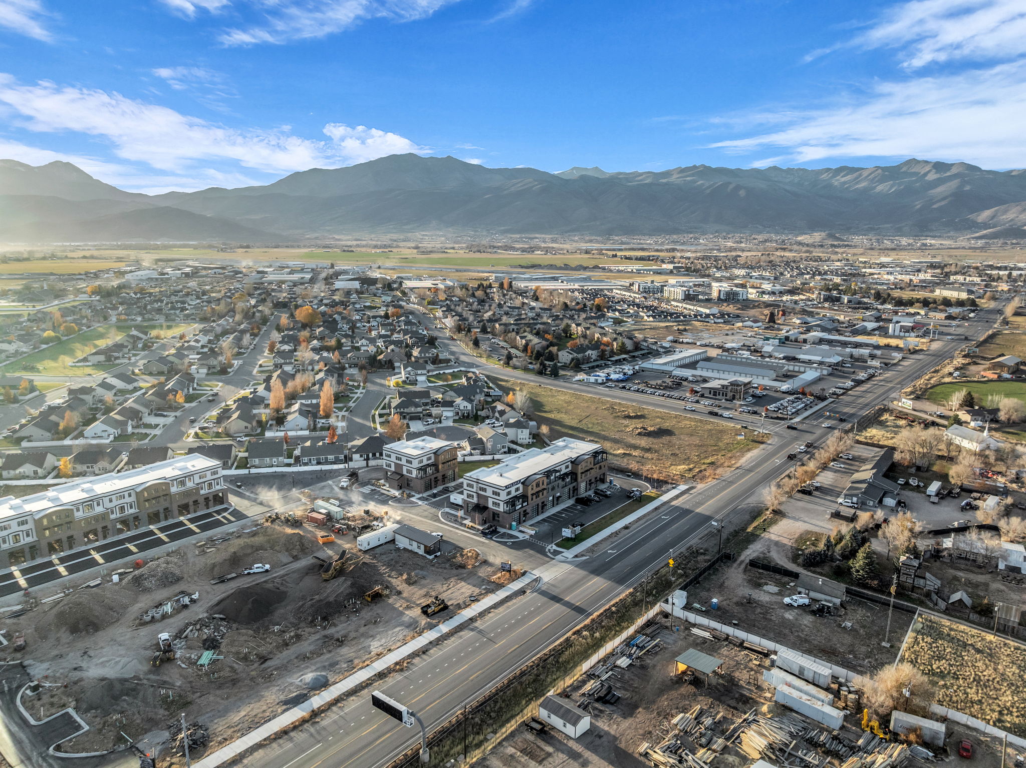 Expansive aerial landscape highlighting a developed community with established residential areas