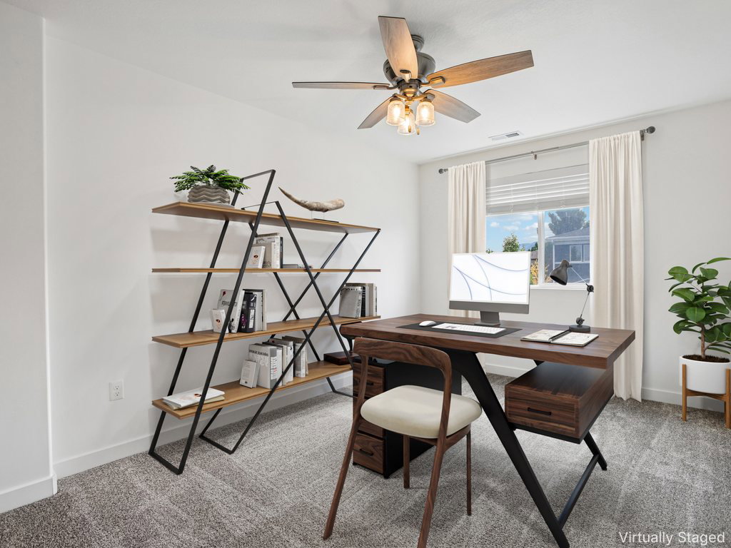 Bright room featuring a window with blinds, a ceiling fan with light fixture, and textured carpet flooring