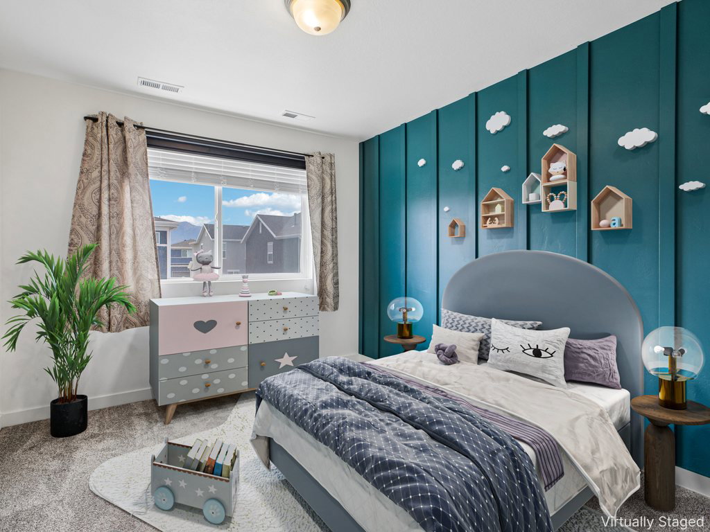 Room featuring a paneled accent wall, a large window, and wall-mounted shelving