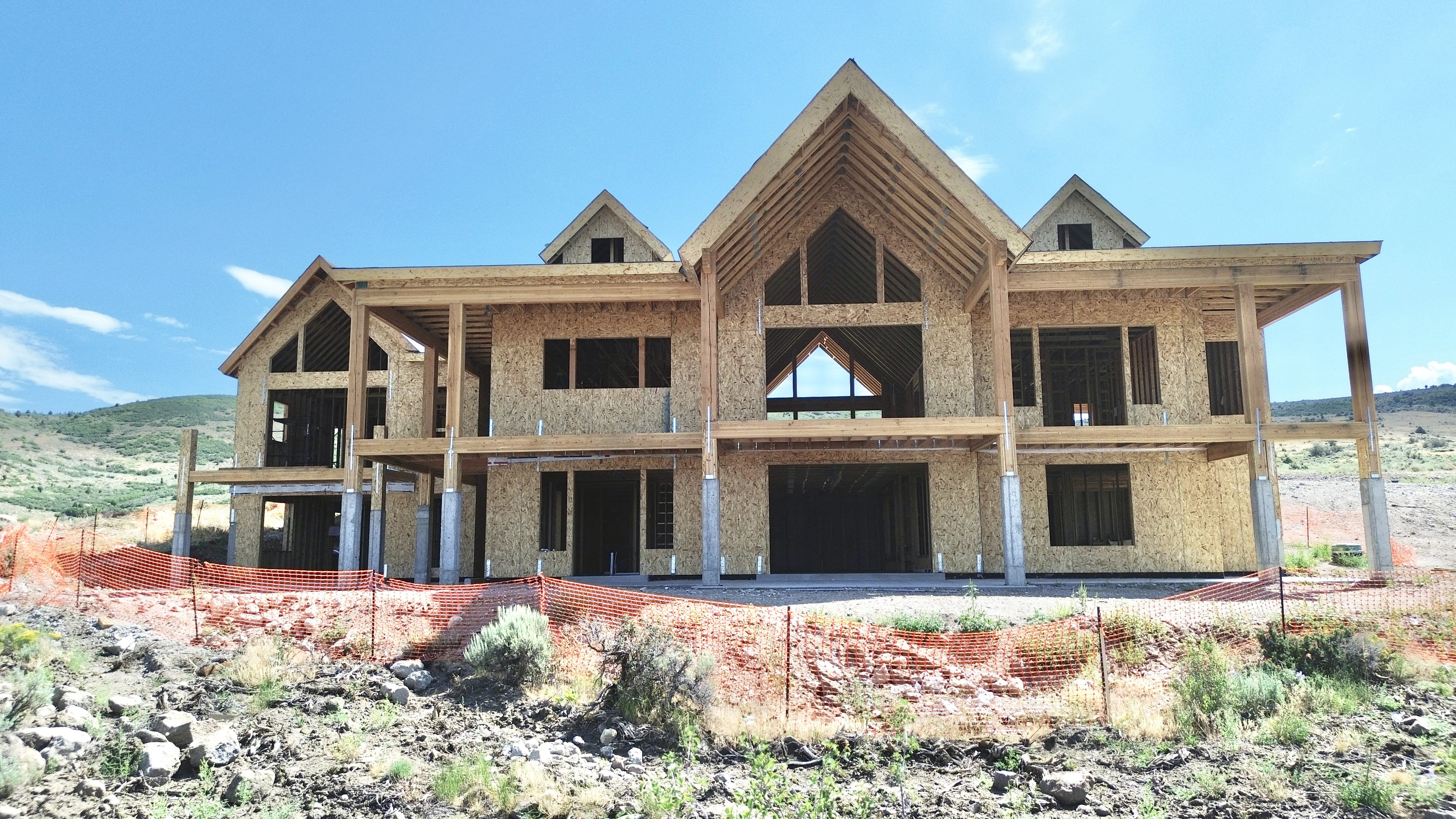 Framed structure featuring a two-story design and exposed timber framing