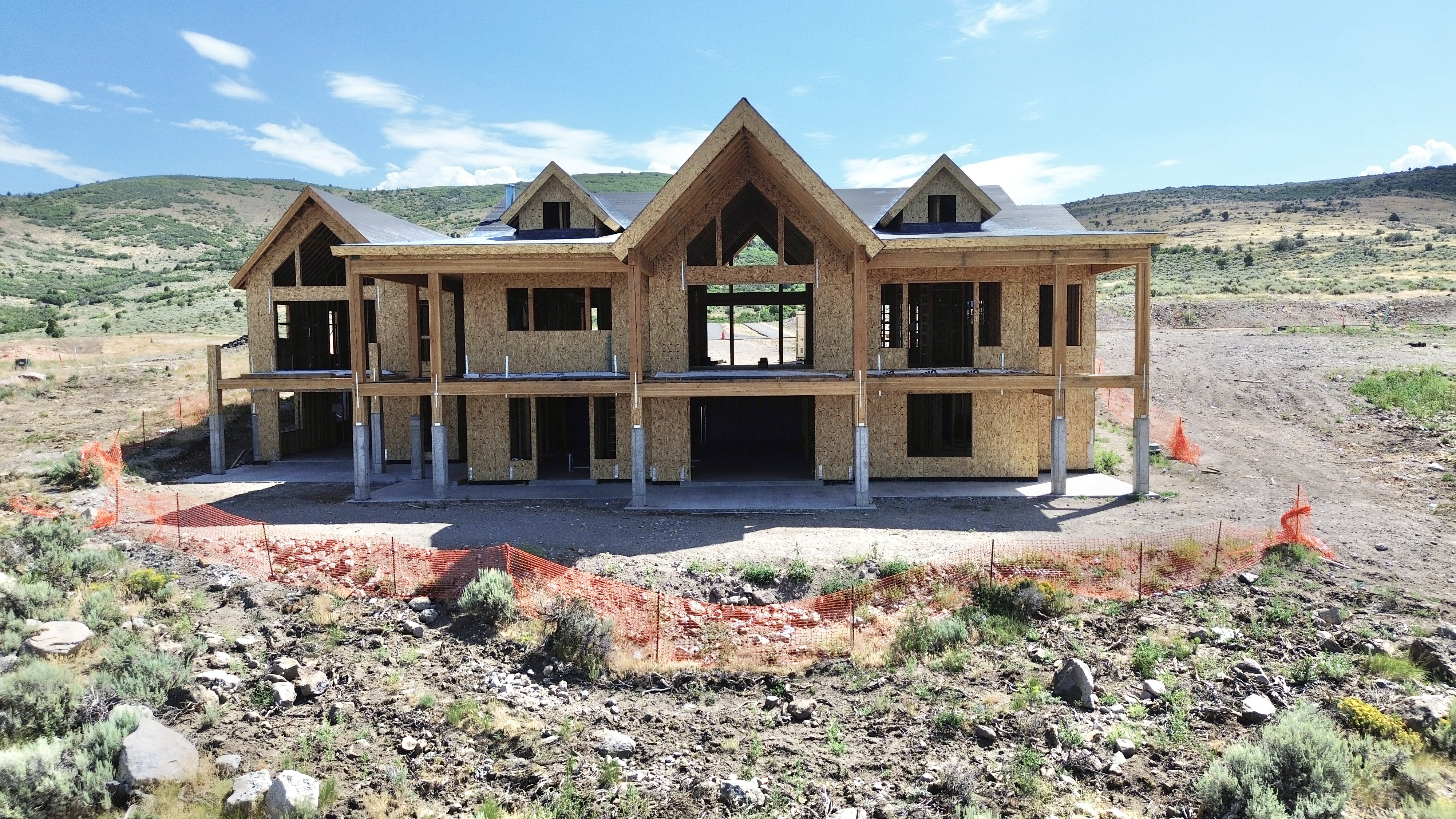 Two-story residential structure featuring a prominent A-frame architectural element