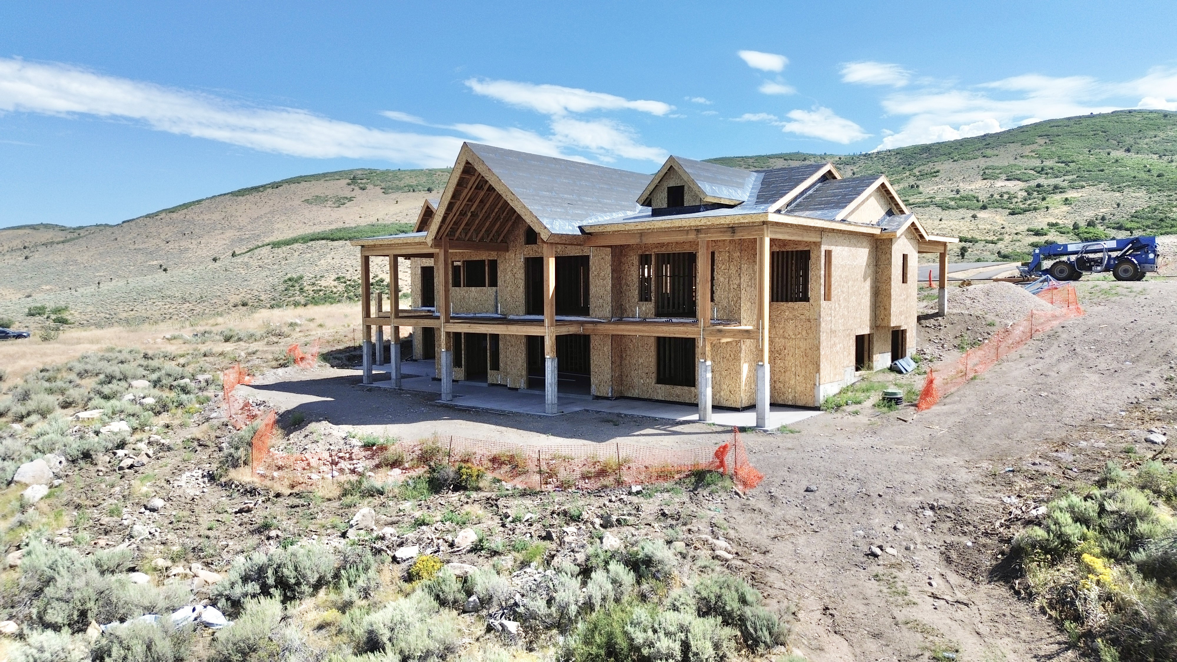 New construction residence featuring a multi-level design and a tiered roofline