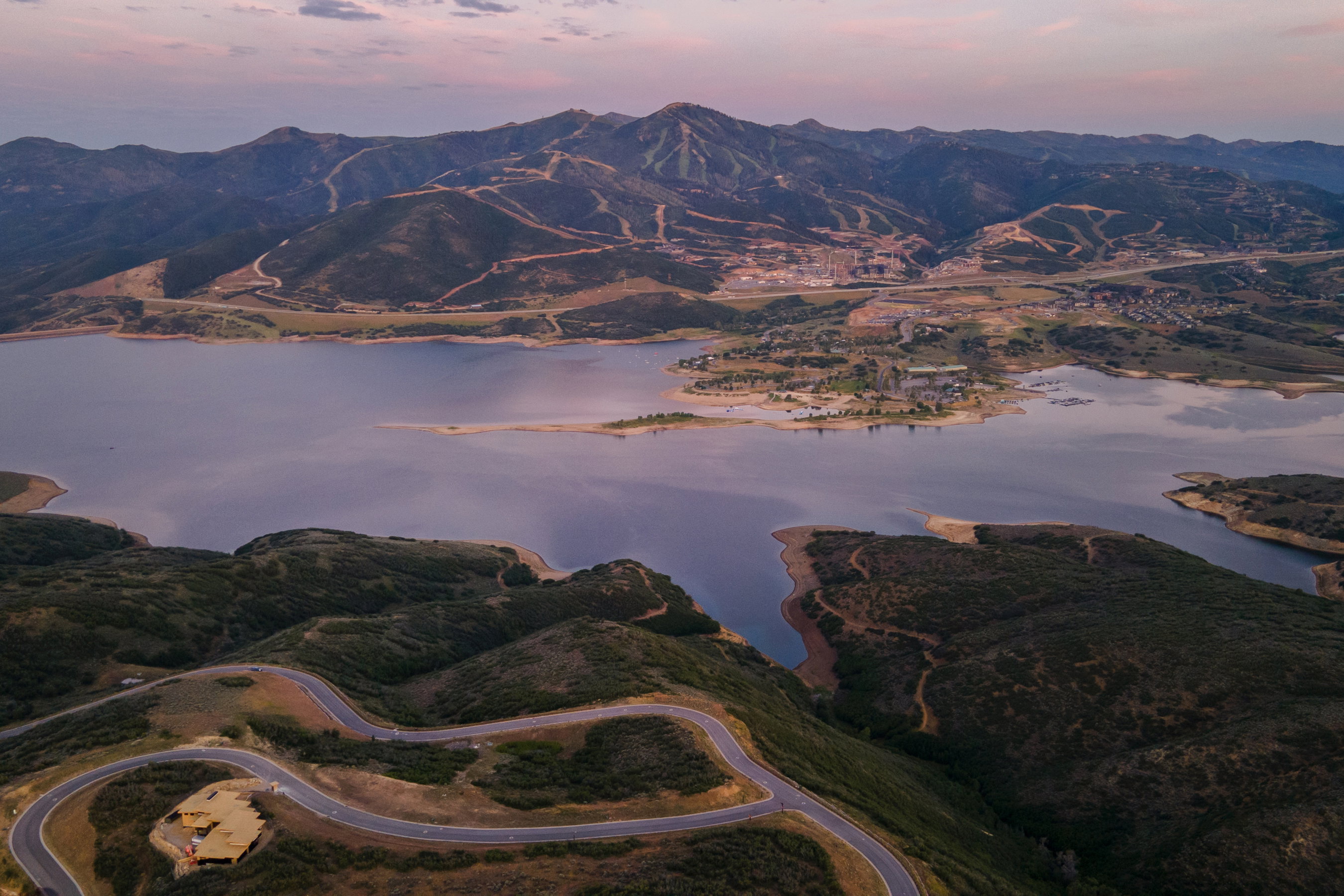 Expansive lakefront setting with surrounding mountainous terrain