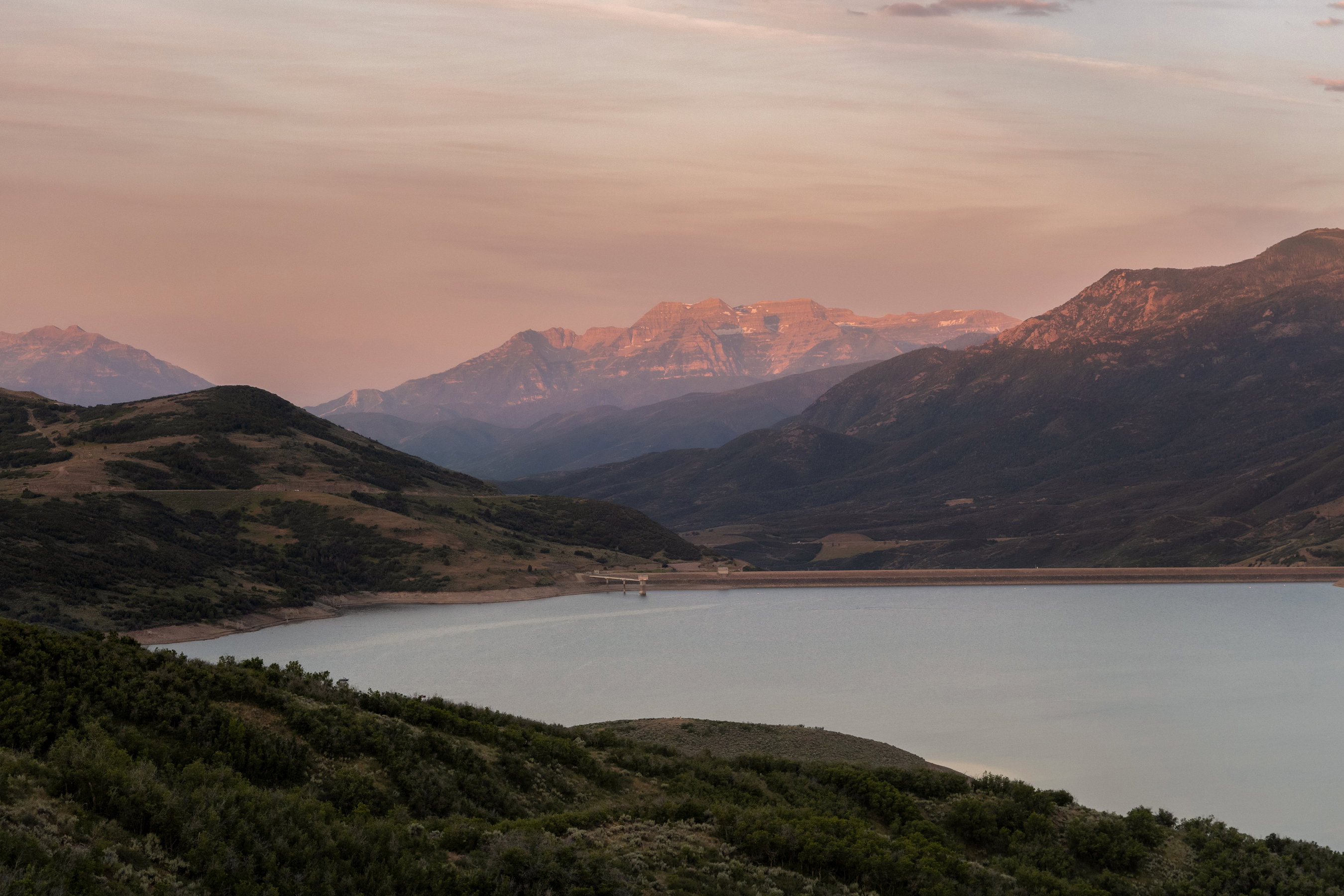 Expansive lake with surrounding mountainous terrain