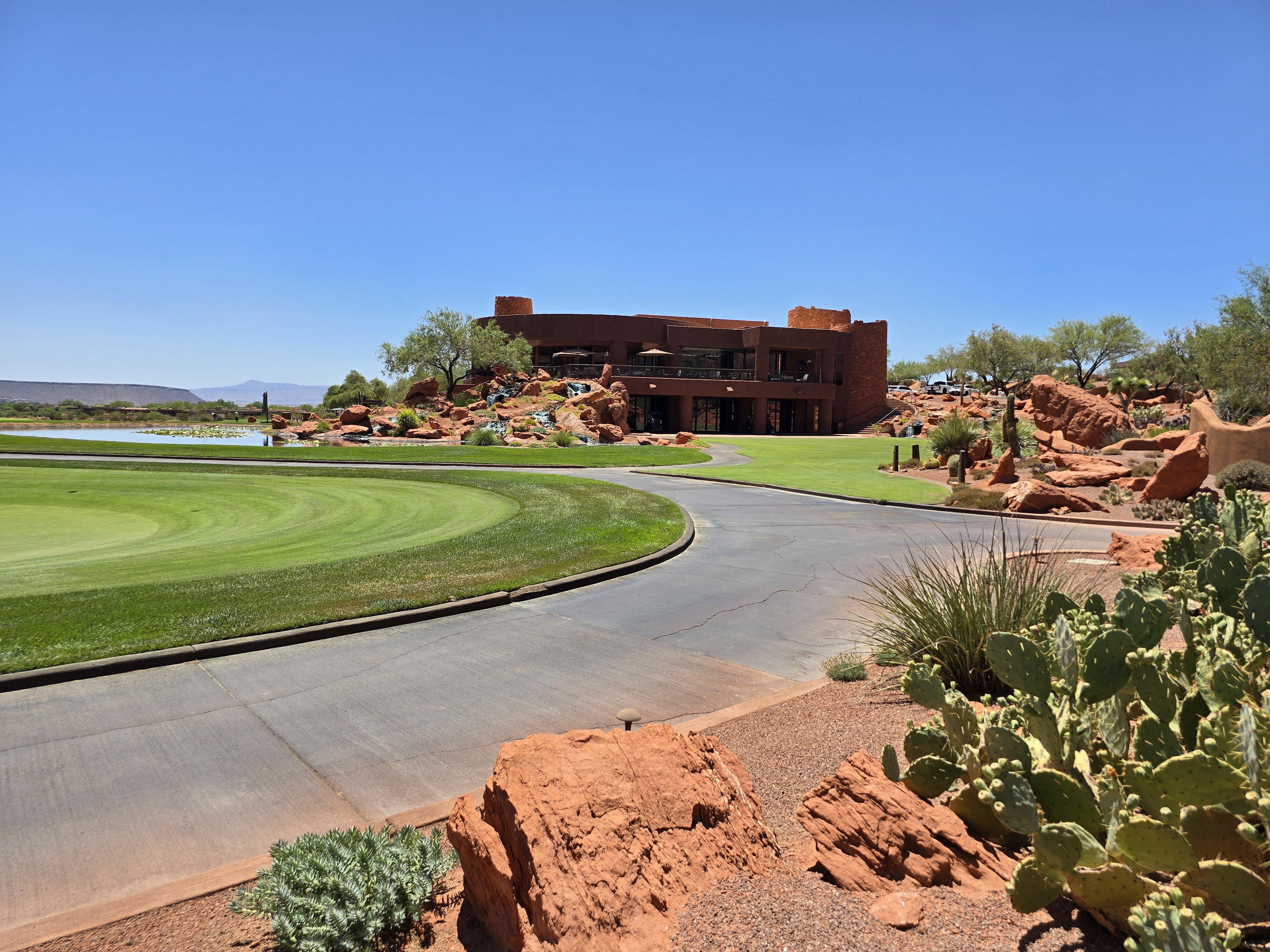 Golf course greens framed by red rock landscaping