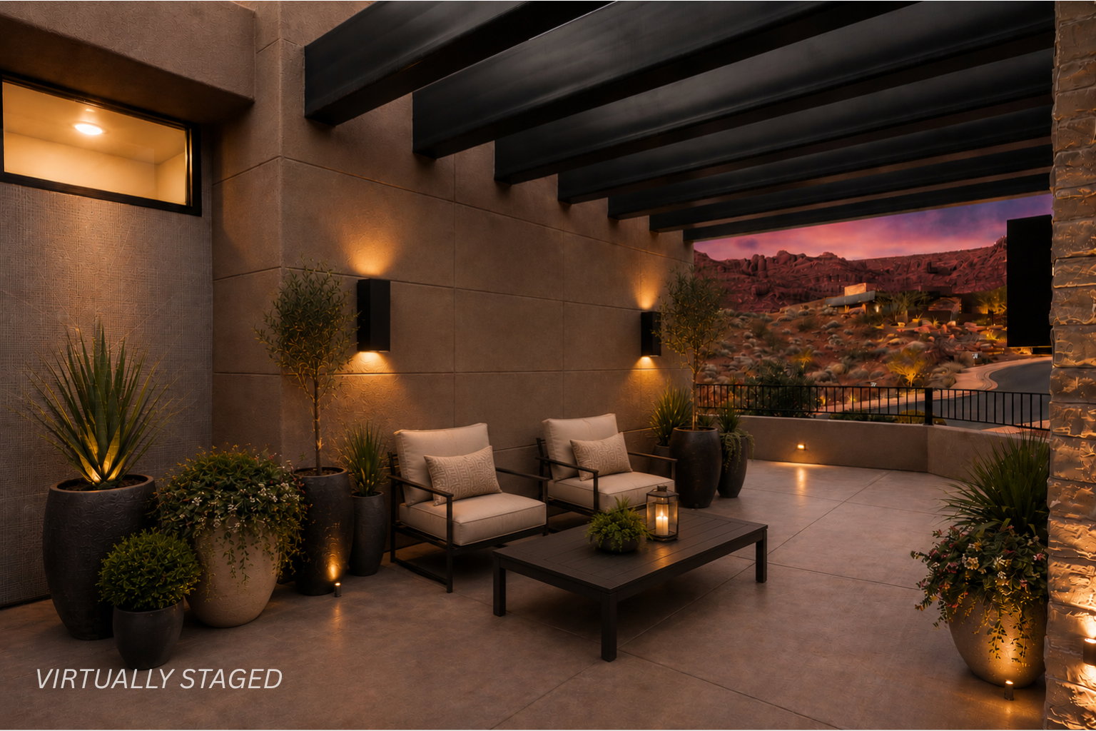 Expansive patio featuring a concrete surface, overhead beams, and integrated wall sconces
