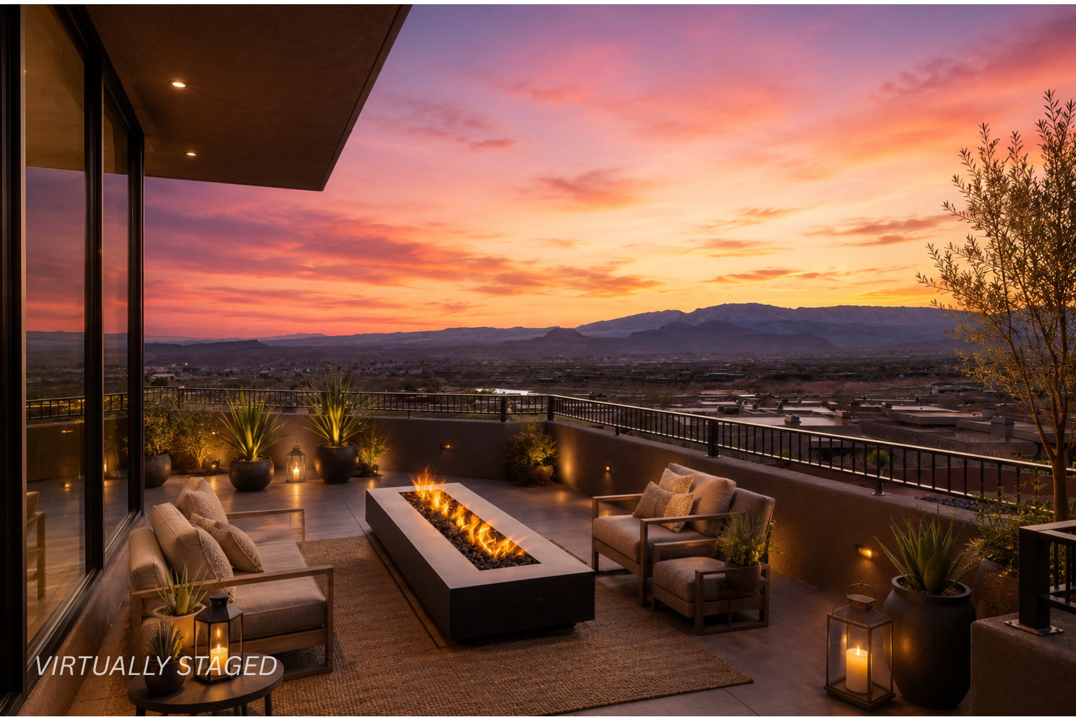 Spacious outdoor patio with a linear fire feature, built-in ambient lighting, and a black metal railing