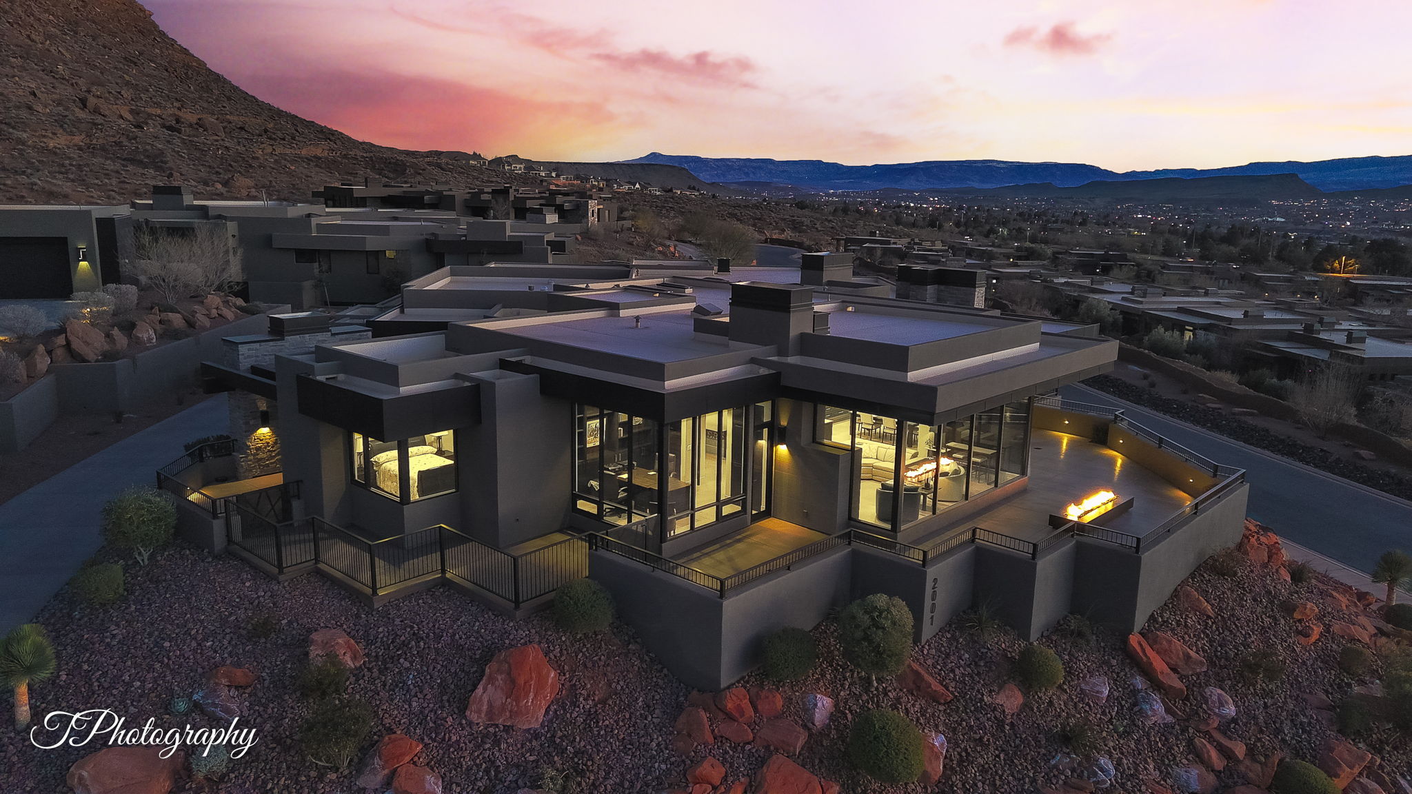 Modern architectural design with a flat roofline and dark exterior finishes