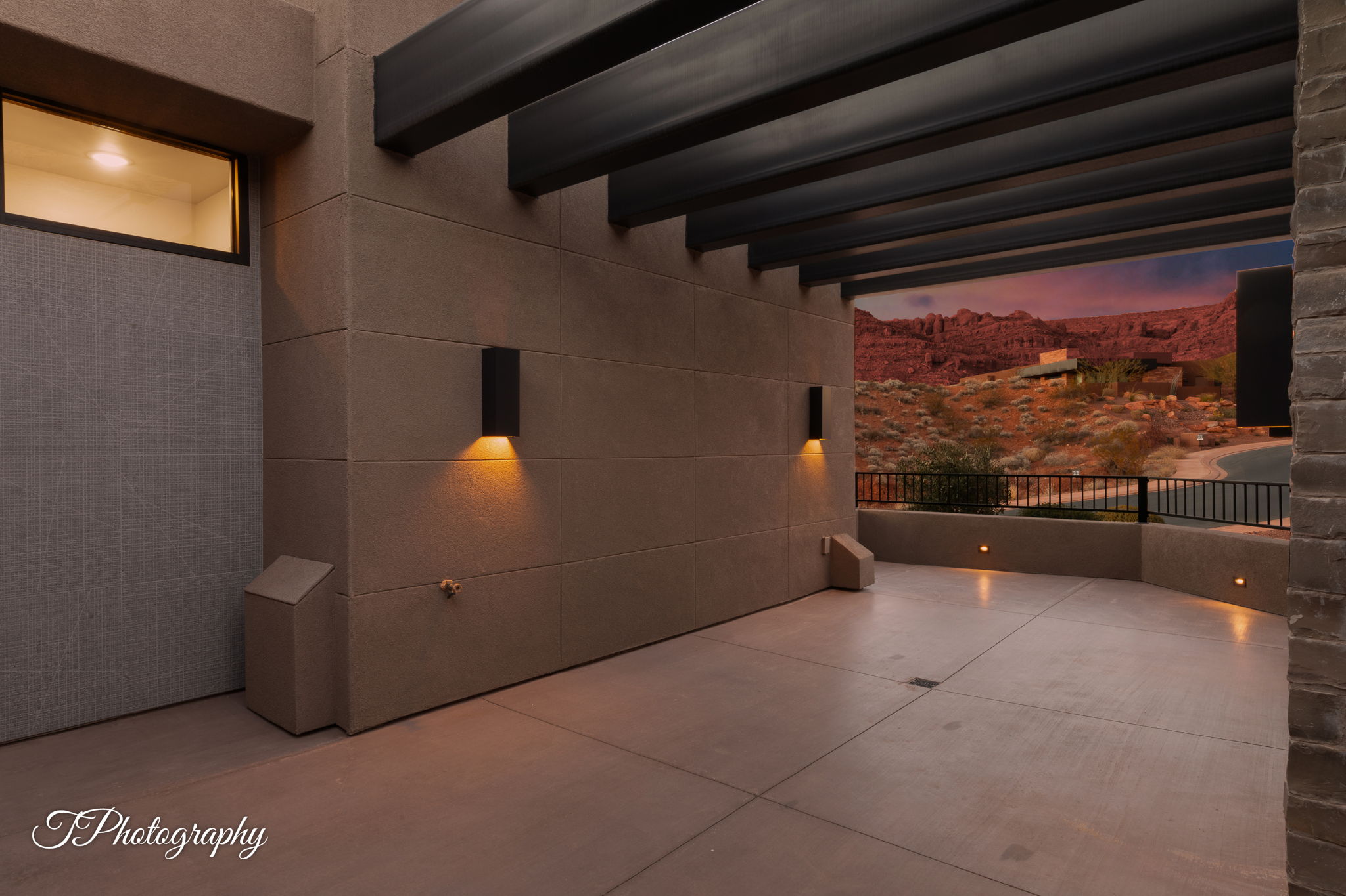 Covered outdoor patio with concrete flooring