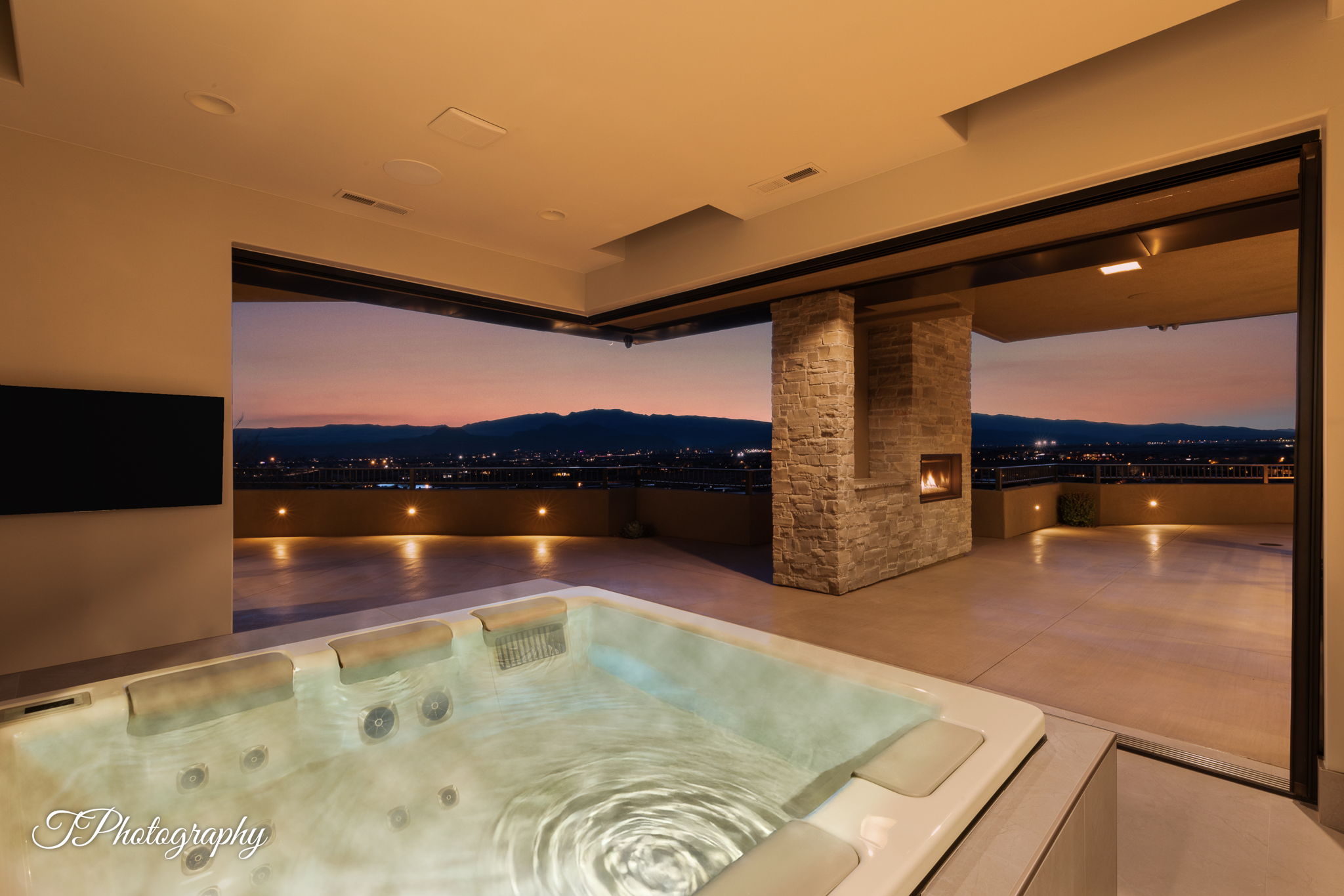Outdoor spa with integrated headrests and multiple jets