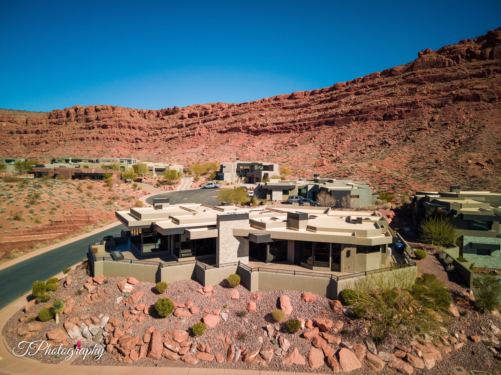 Modern desert architecture featuring a flat roofline and integrated patios