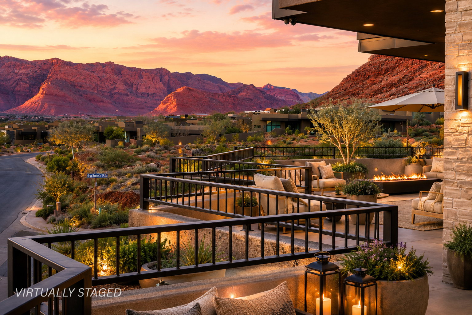 Expansive outdoor patio with multiple seating areas, a rectangular fire pit, and stone accent walls