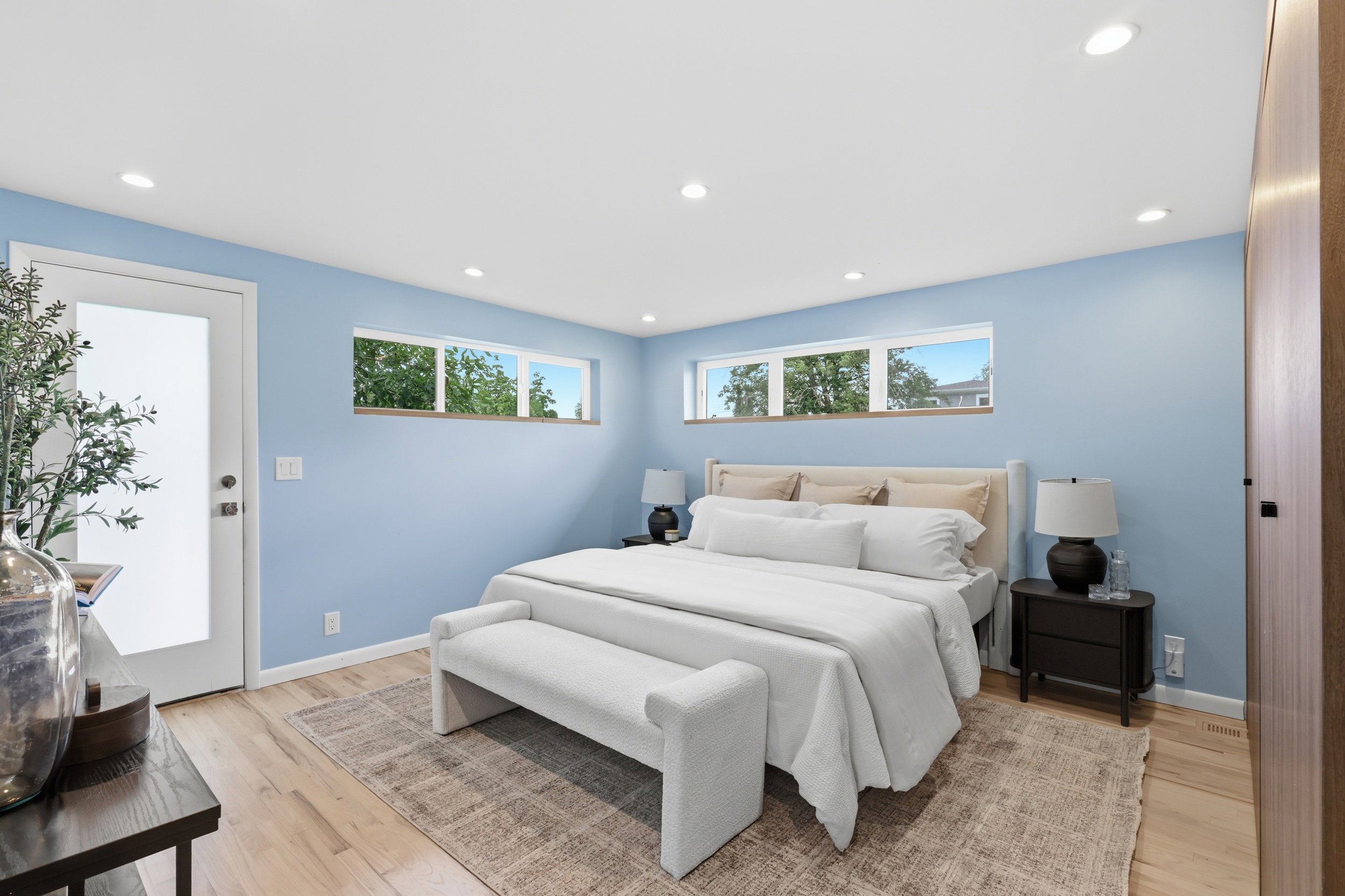 Light wood-finish flooring with recessed lighting