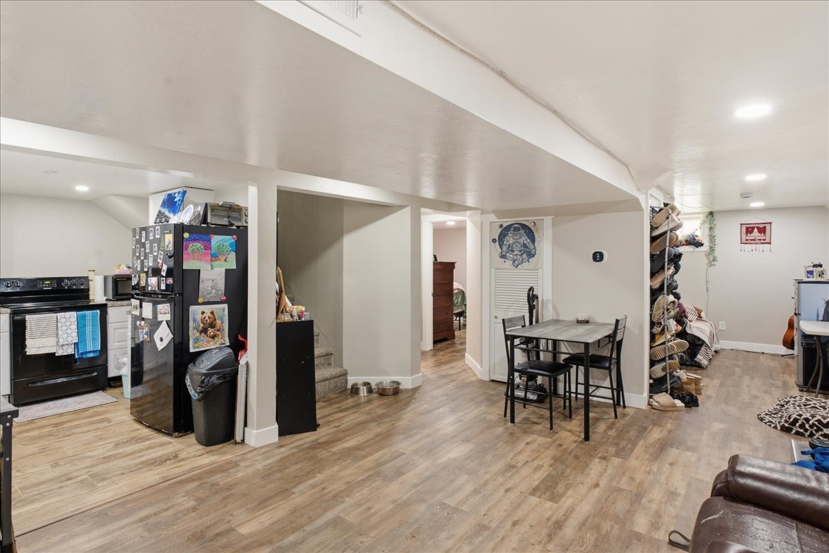 Open-concept lower level featuring wood-finish flooring throughout