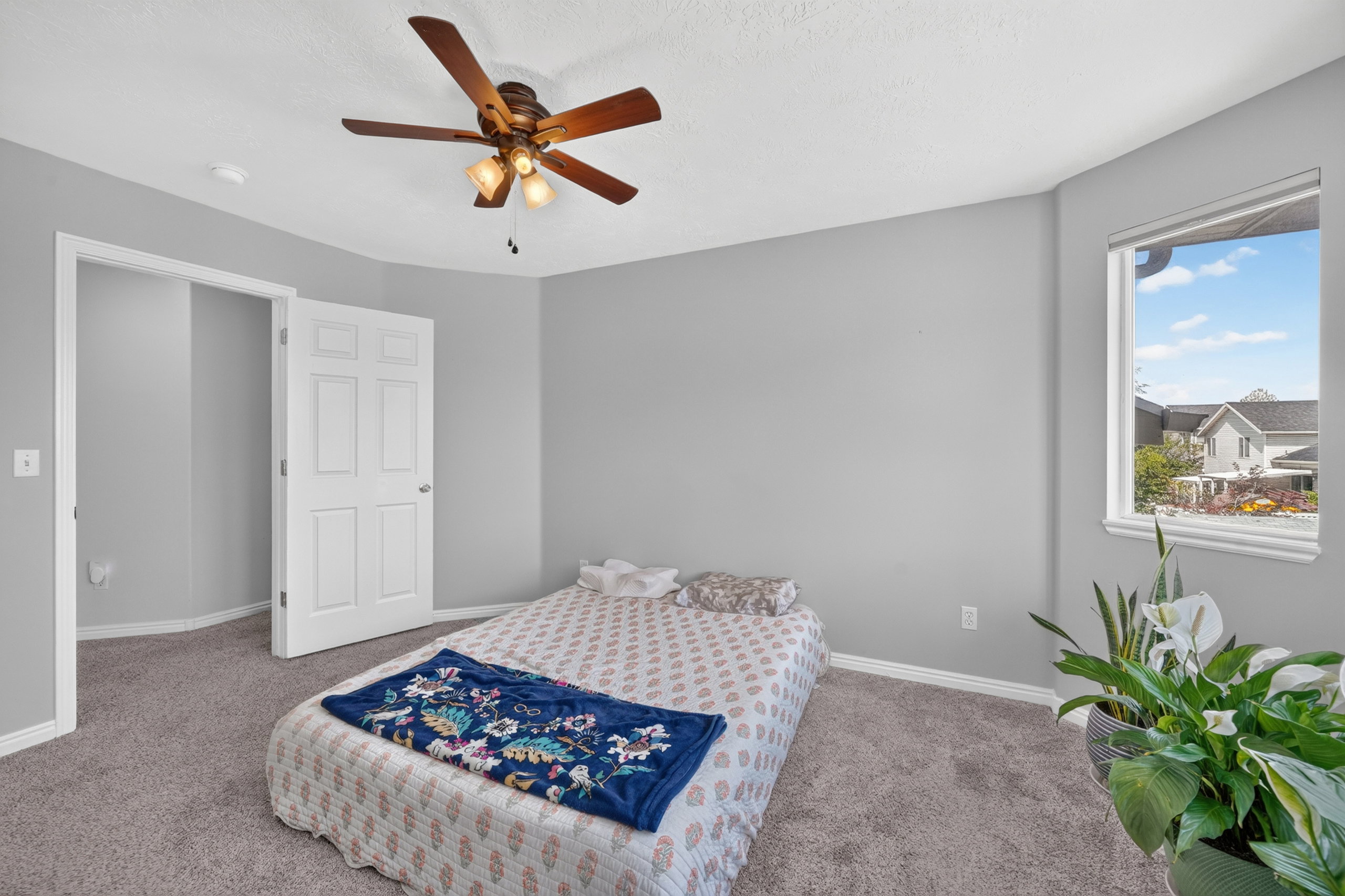 Neutral gray walls complement the textured gray carpeting in this room
