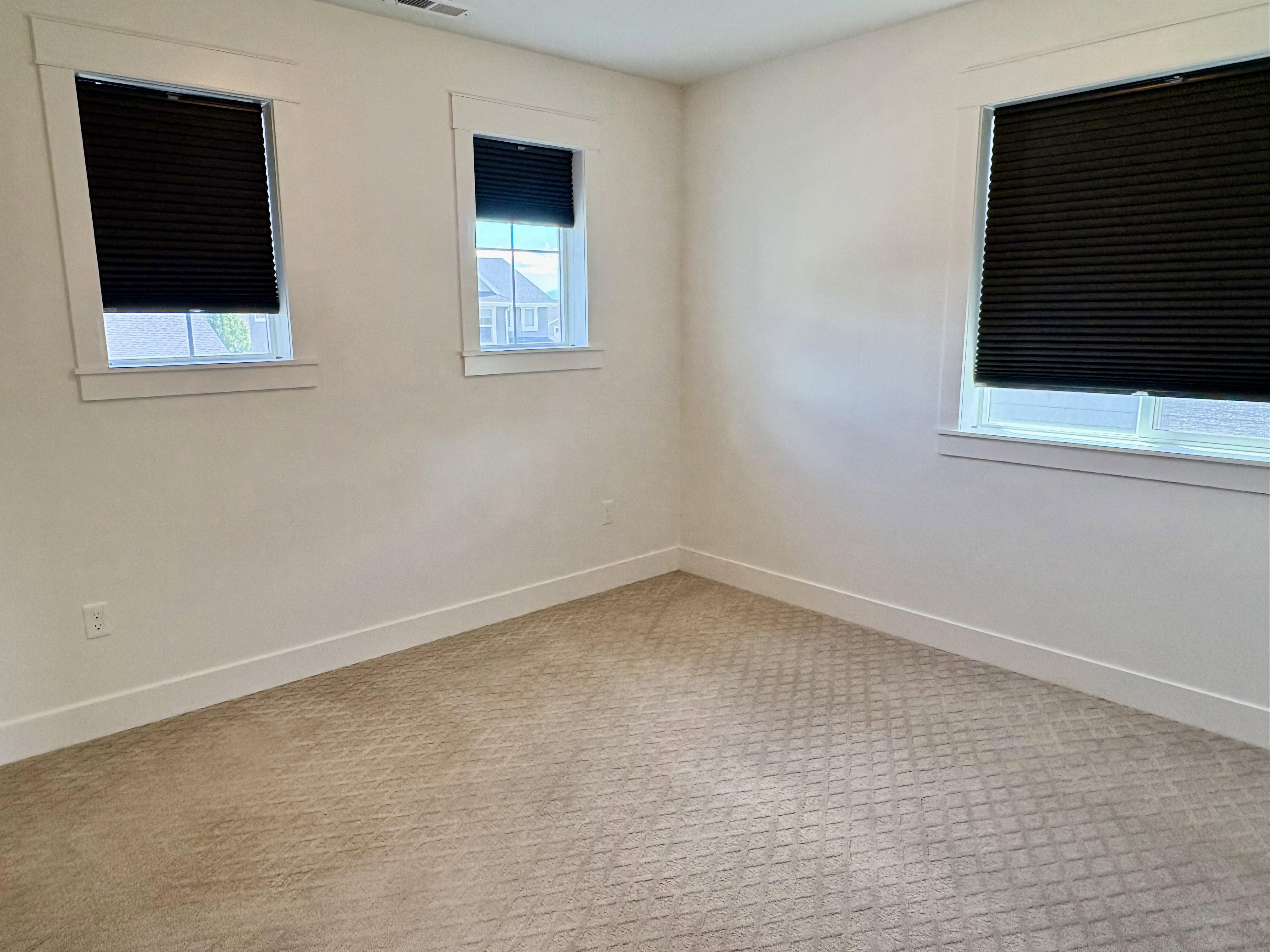 Neutral tone walls with white trim and baseboards
