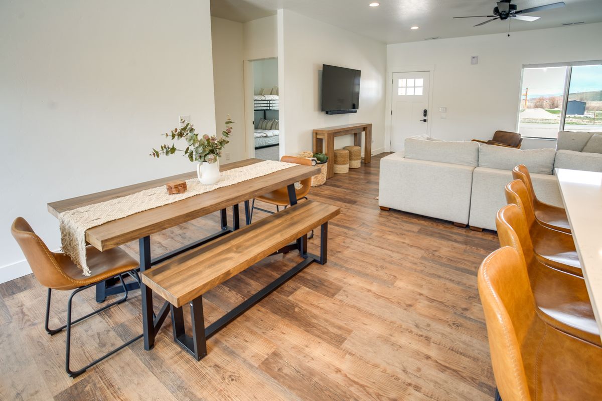 Open-concept living space featuring wood-finish flooring throughout