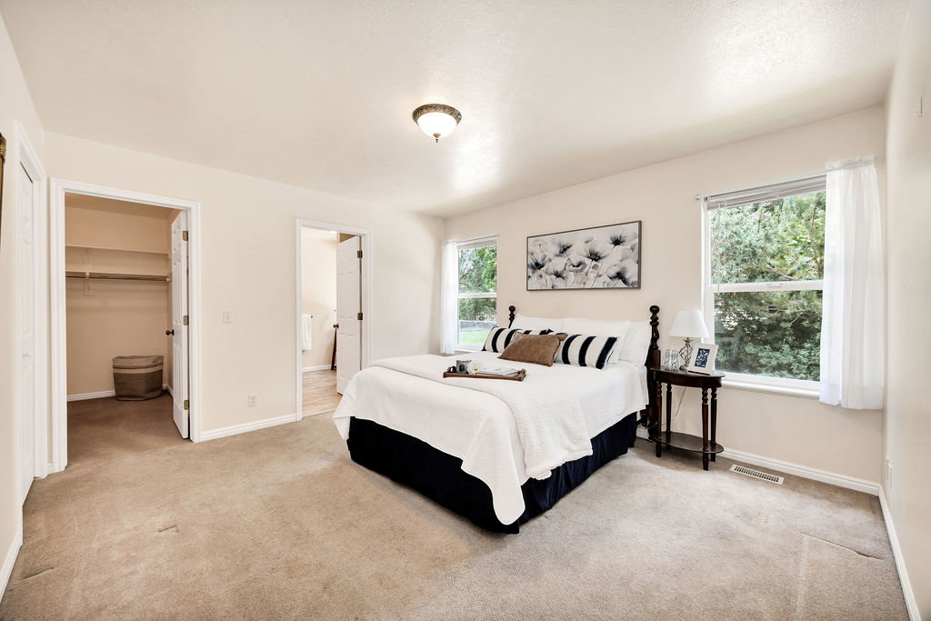 Large primary suite walk-in closet, next to giant linen closet