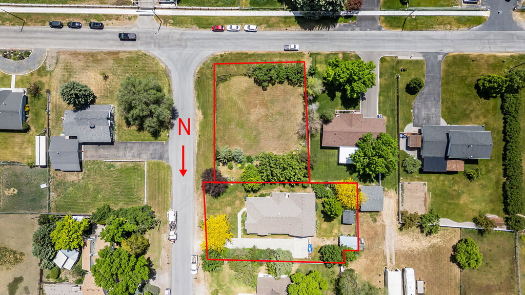 Aerial perspective showcasing the house and the buildable vacant lot just south of the house for sale separately or as a package deal for a discount