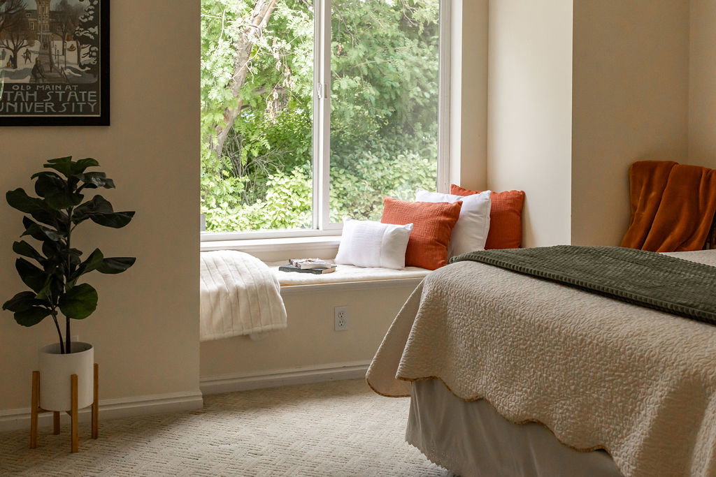 Window-side alcove with a built-in bench, offering abundant natural light