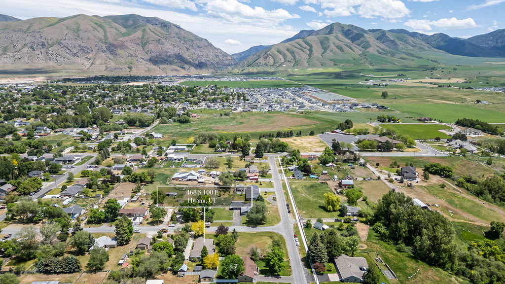 Aerial perspective showcasing the residential neighborhood to the east and the entrance to Blacksmith Fork Canyon