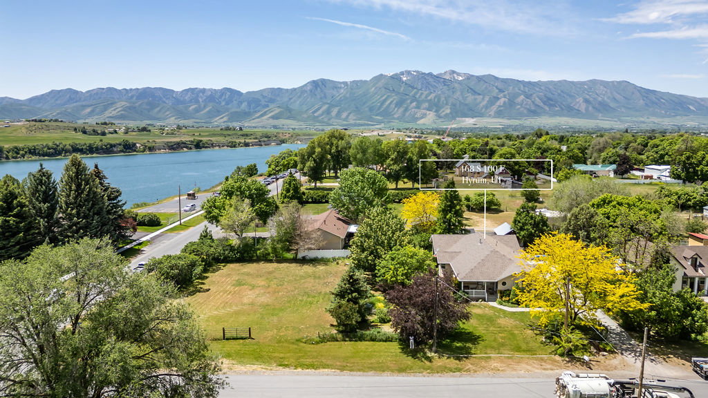 West facing aerial perspective showcasing the property  and proximity to the lake and the Wellsville mountain backdrop