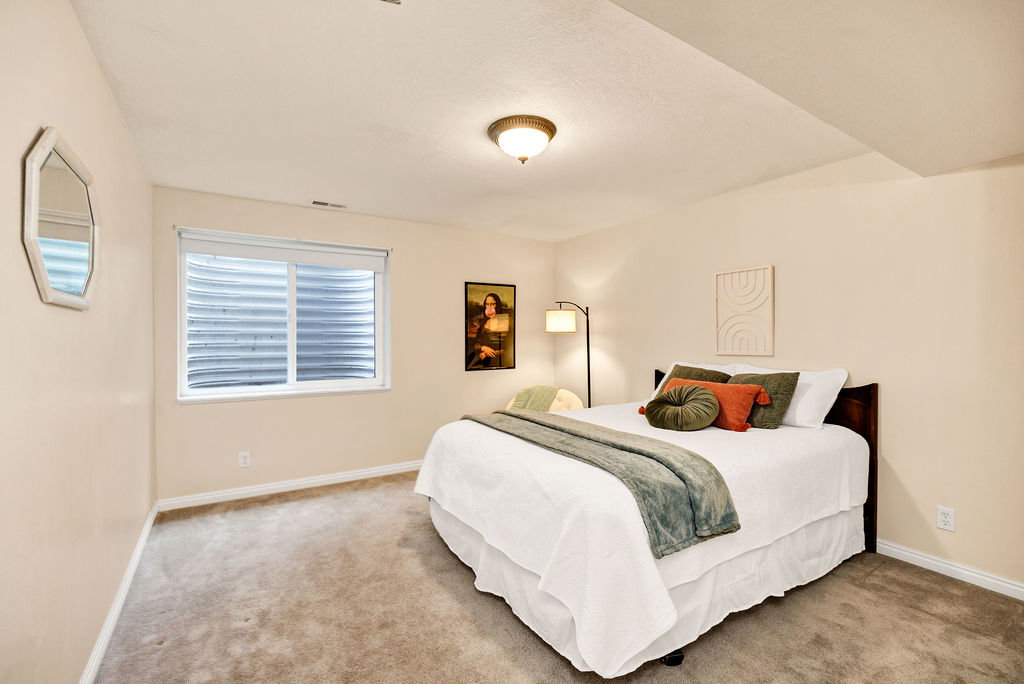 Basement bedroom featuring a single window and recessed lighting