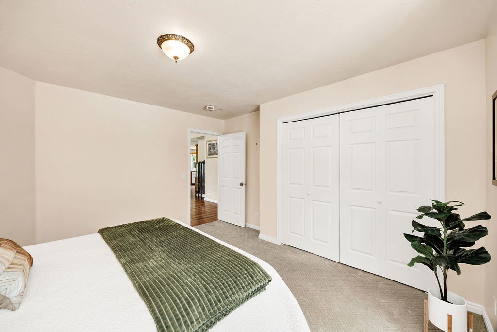 Neutral tone wall paint with a textured ceiling, featuring a semi-flush mount ceiling light fixture