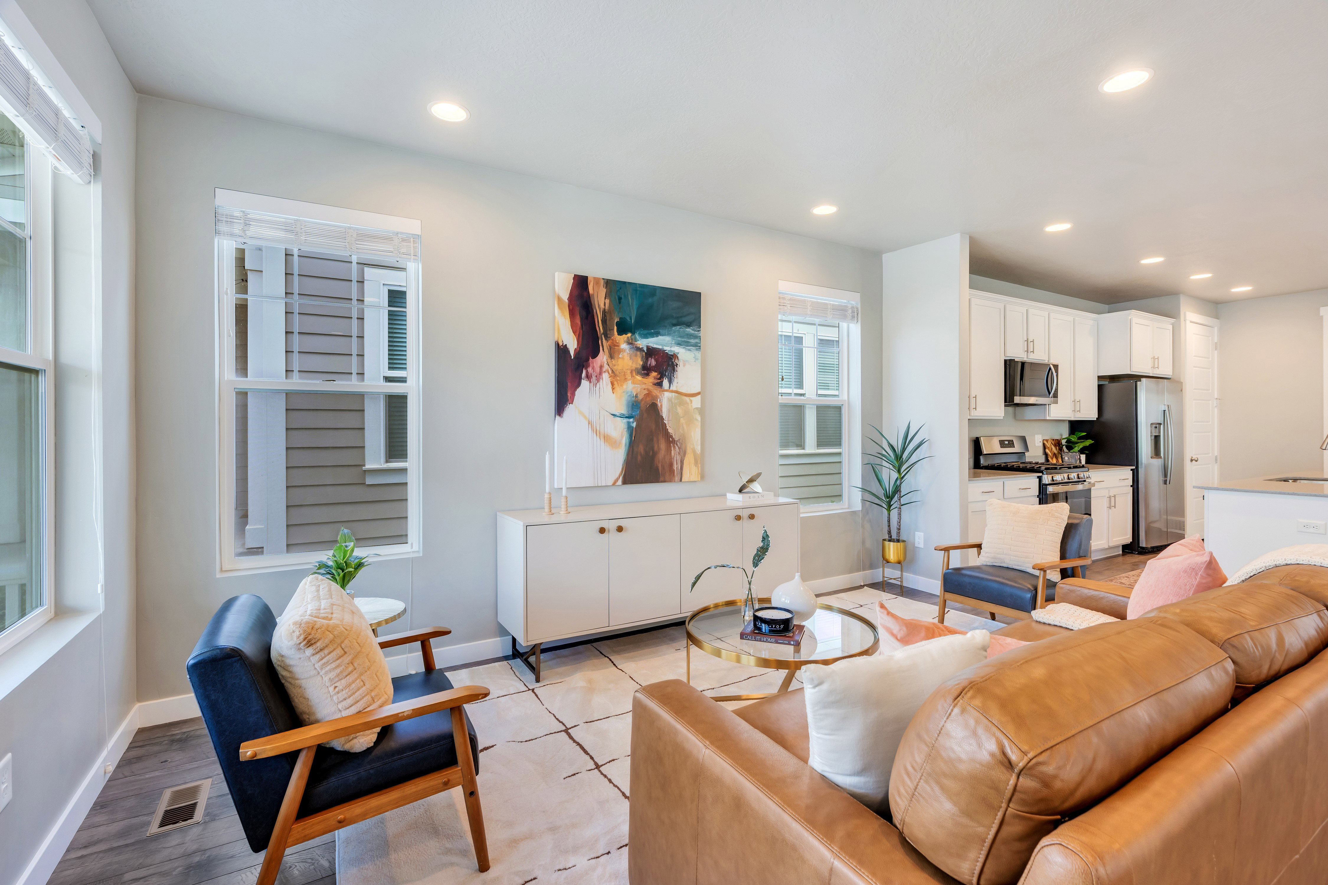 Open concept living area with recessed lighting and light gray wall paint