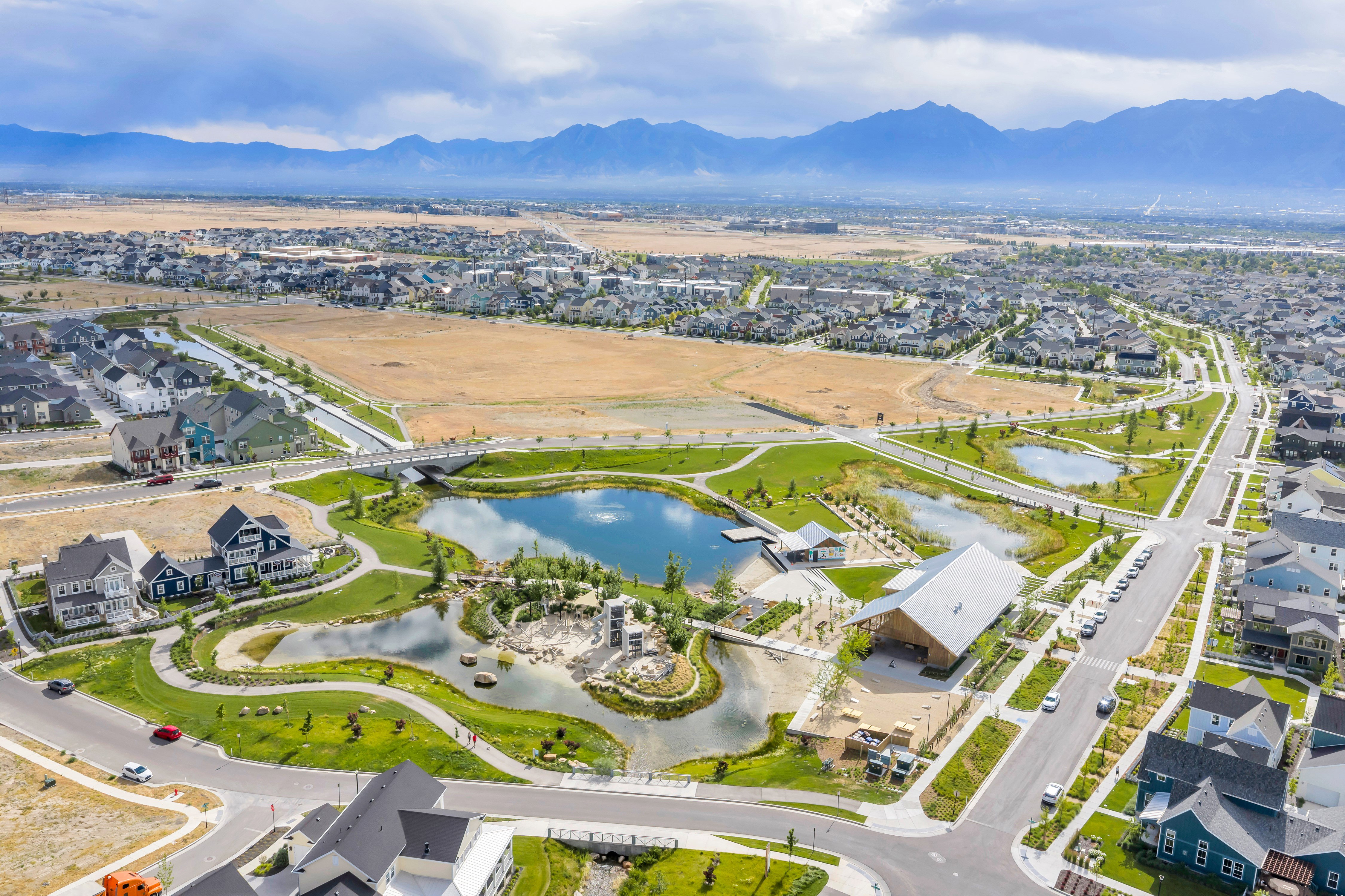 Expansive aerial showcasing a planned community with multiple residential structures