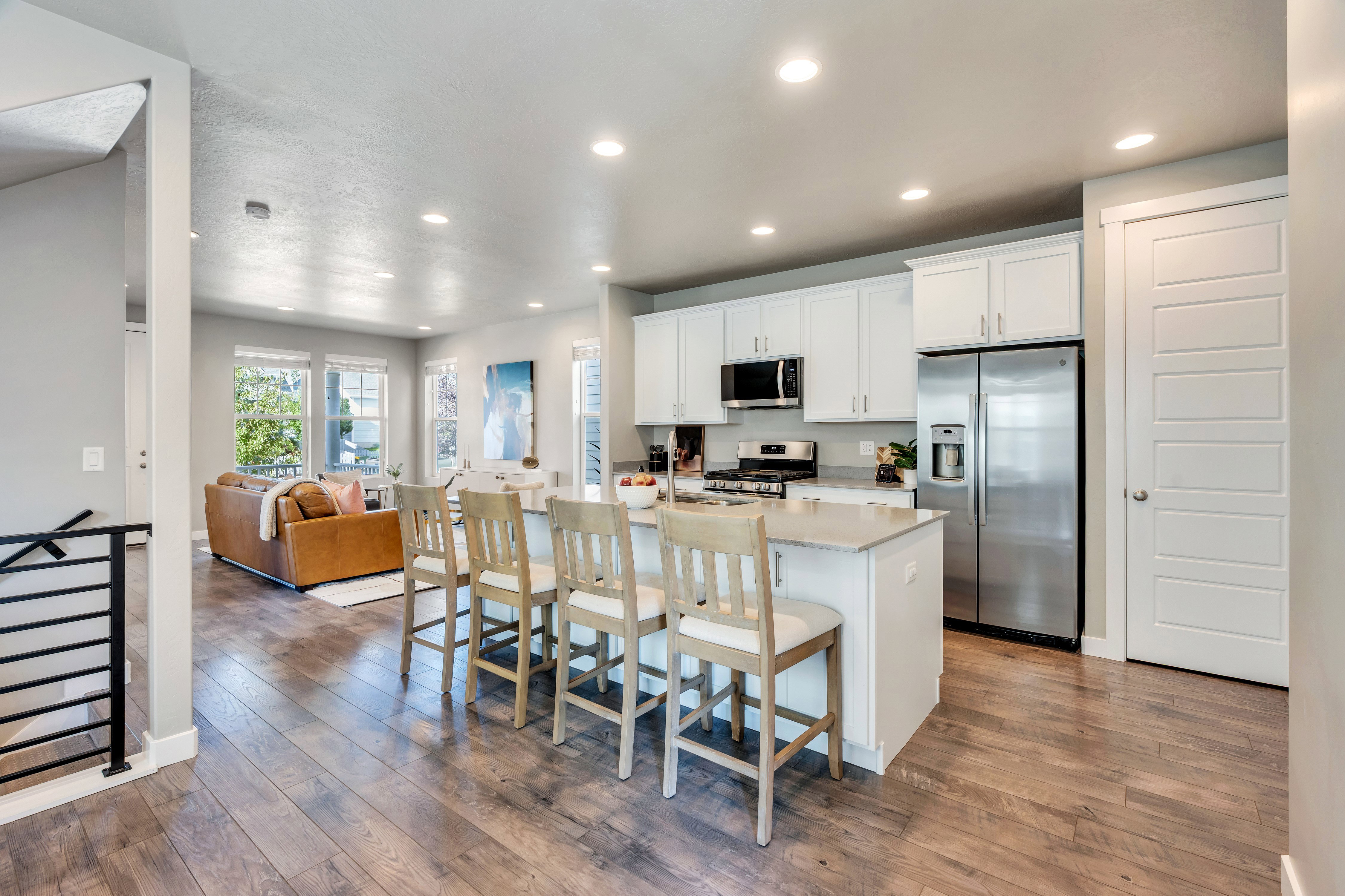 Open-concept living space featuring wood-finish flooring throughout