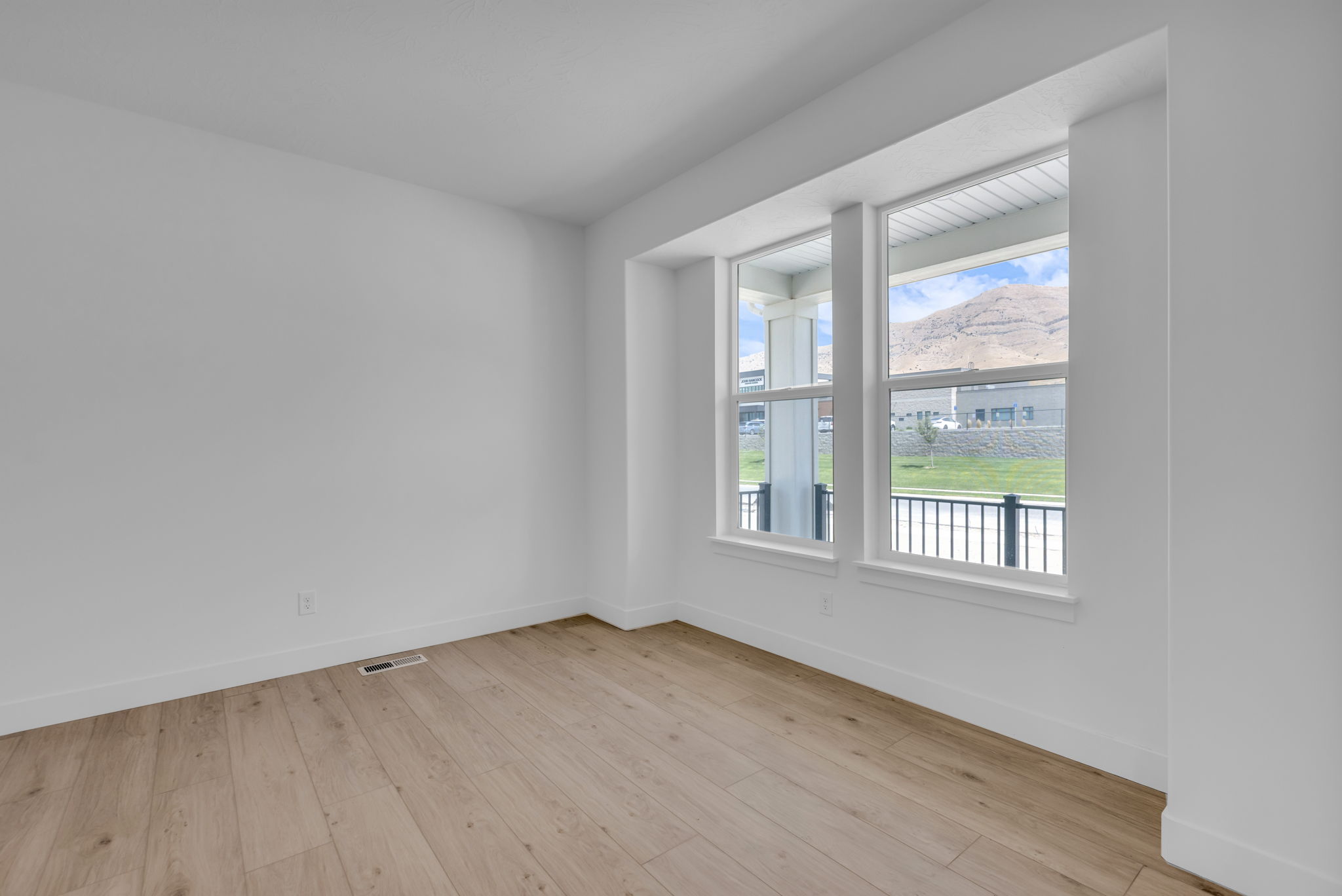 Bright flex space with large windows looking to the mountains.