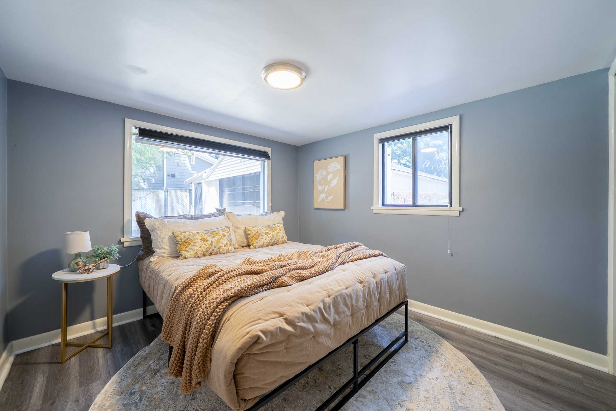 Spacious room with two windows providing ample natural light
