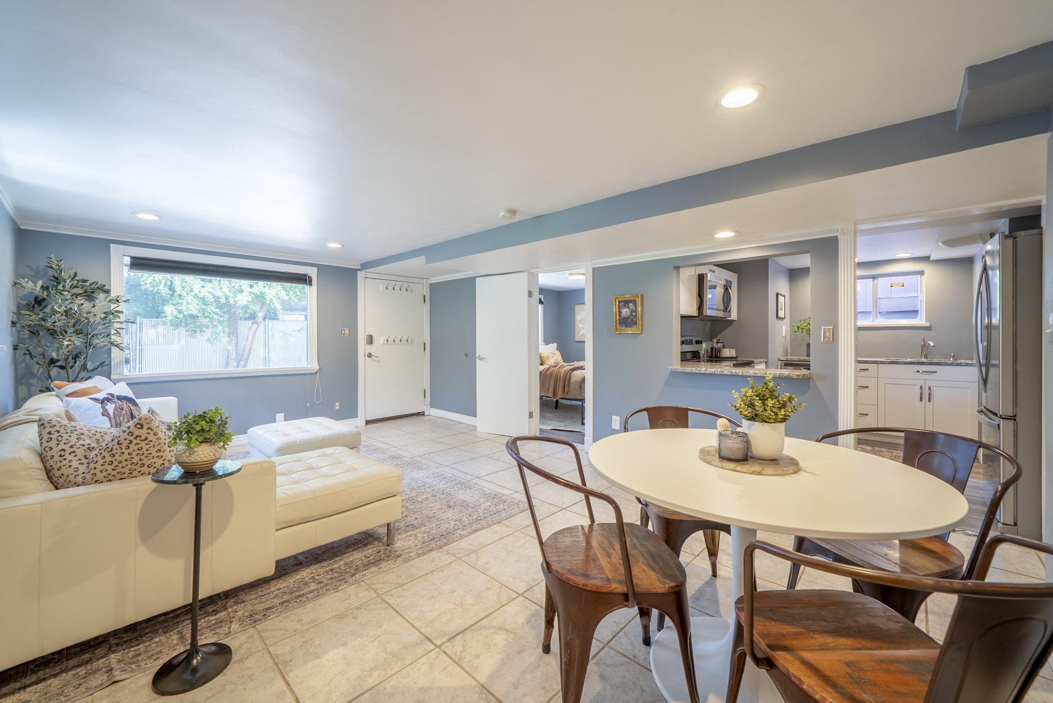 Spacious recreation room featuring recessed lighting and tile flooring