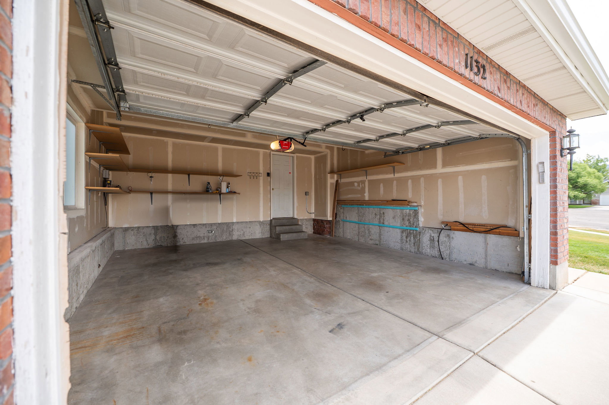 Spacious two-car garage with concrete flooring