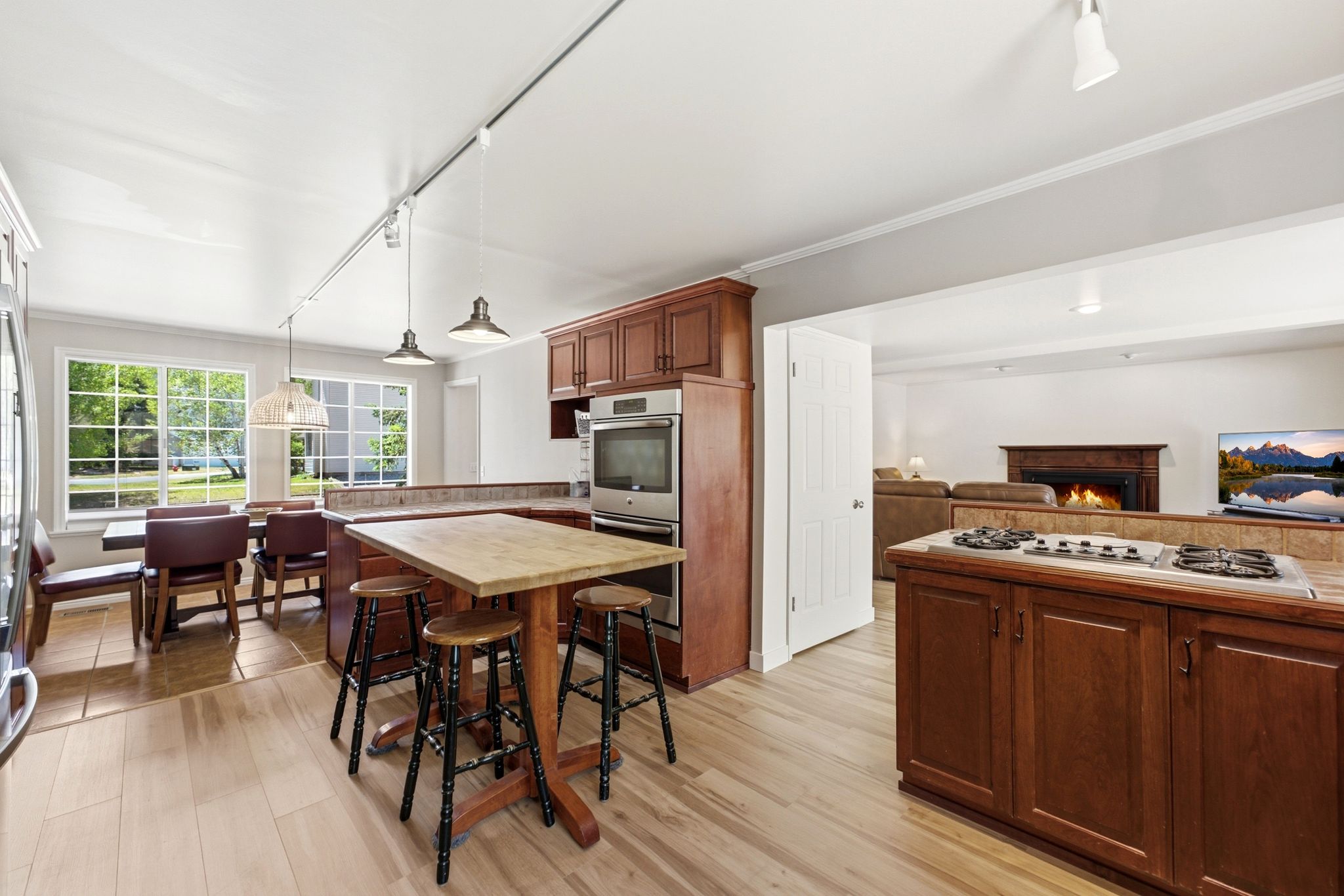 Kitchen featuring wood-finish flooring and track lighting