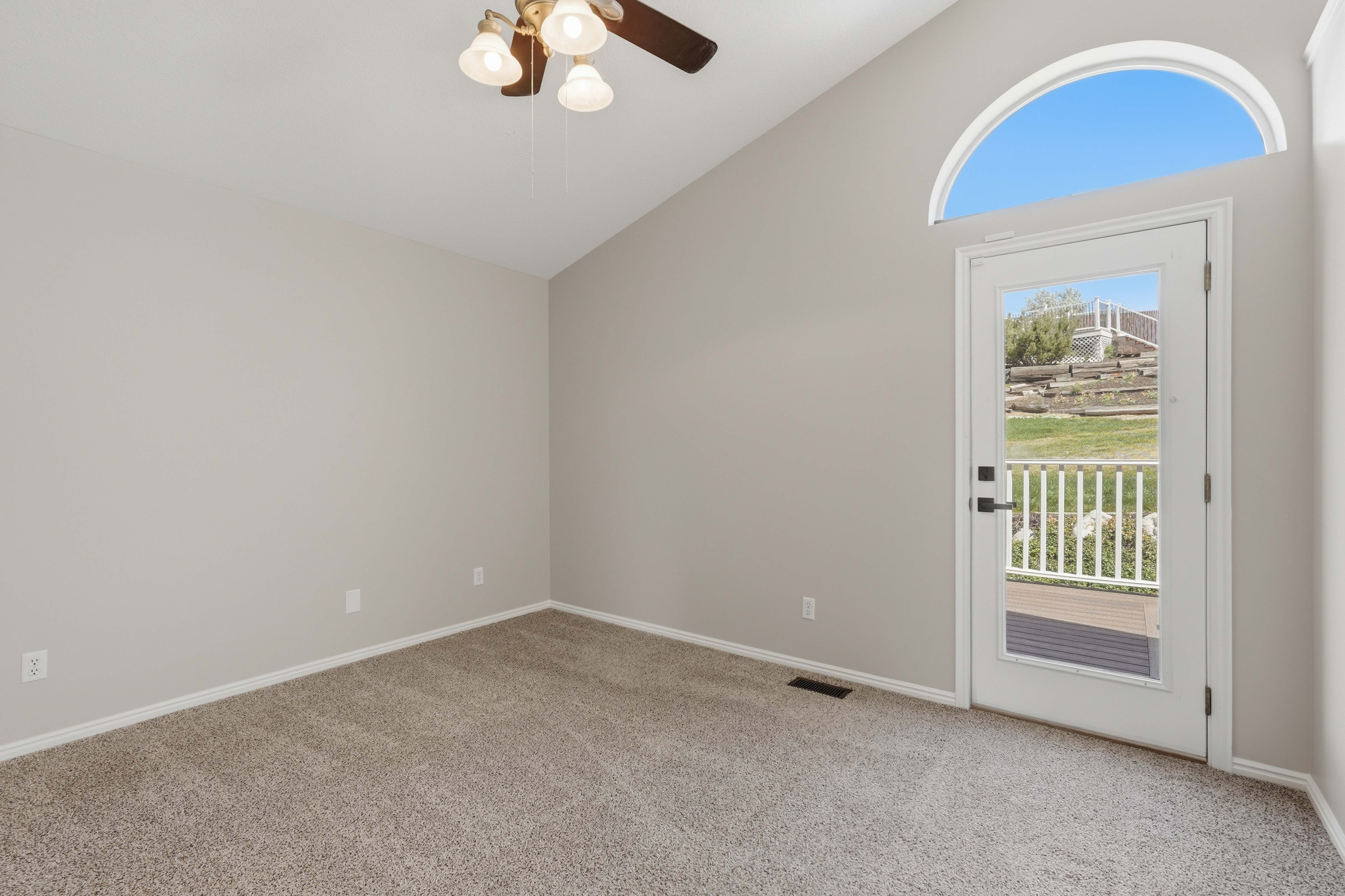 Vaulted ceiling with ceiling fan and light fixture