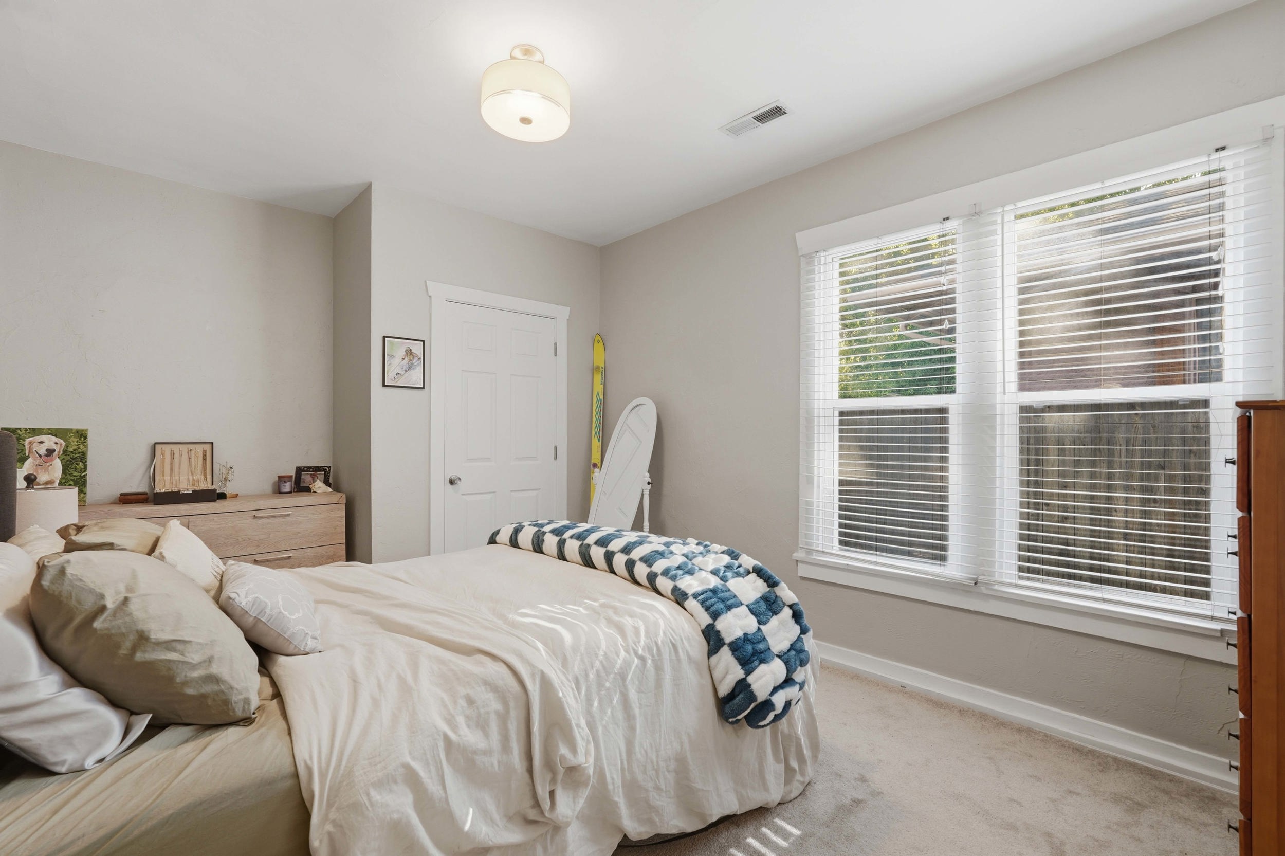 Neutral-toned interior featuring carpet flooring and white trim